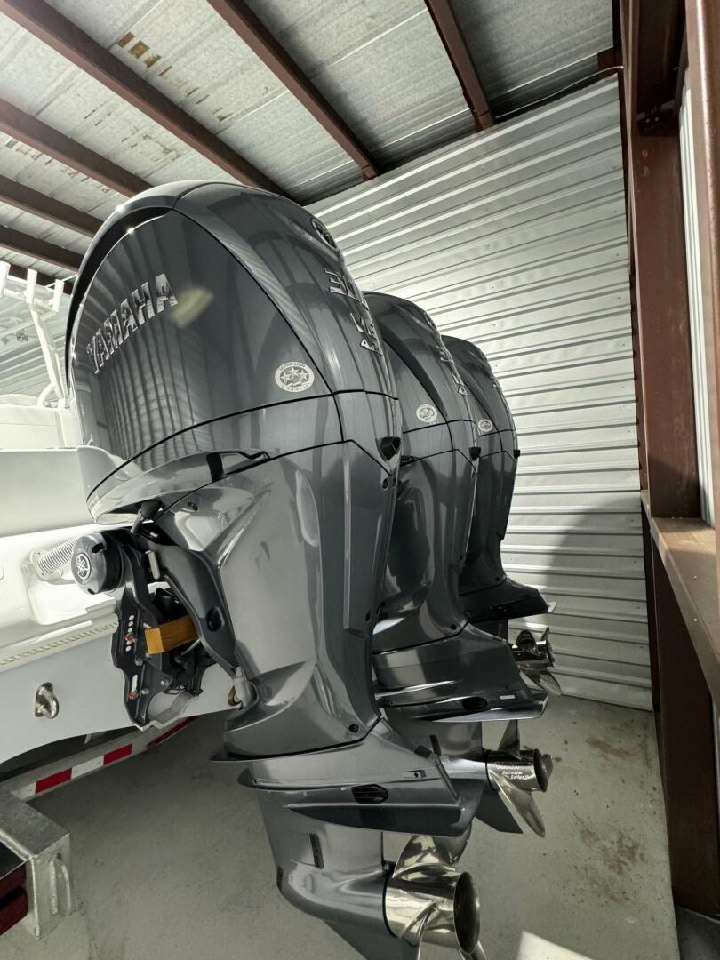 2024 Yellowfin 36 boat with triple outboard engines in storage.