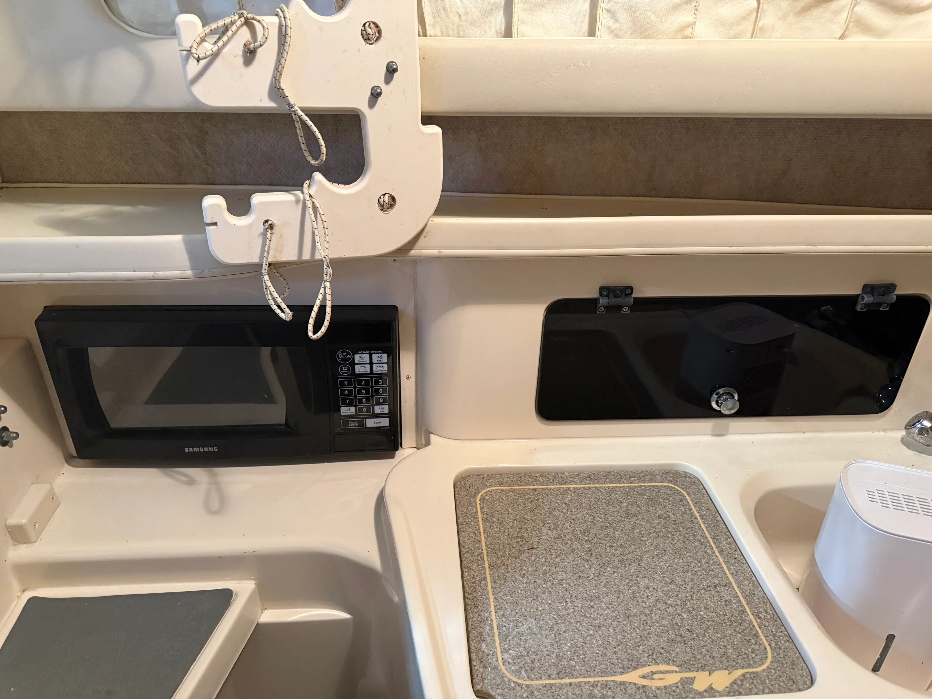 Interior of Grady-White Marlin 300 with microwave and countertop.