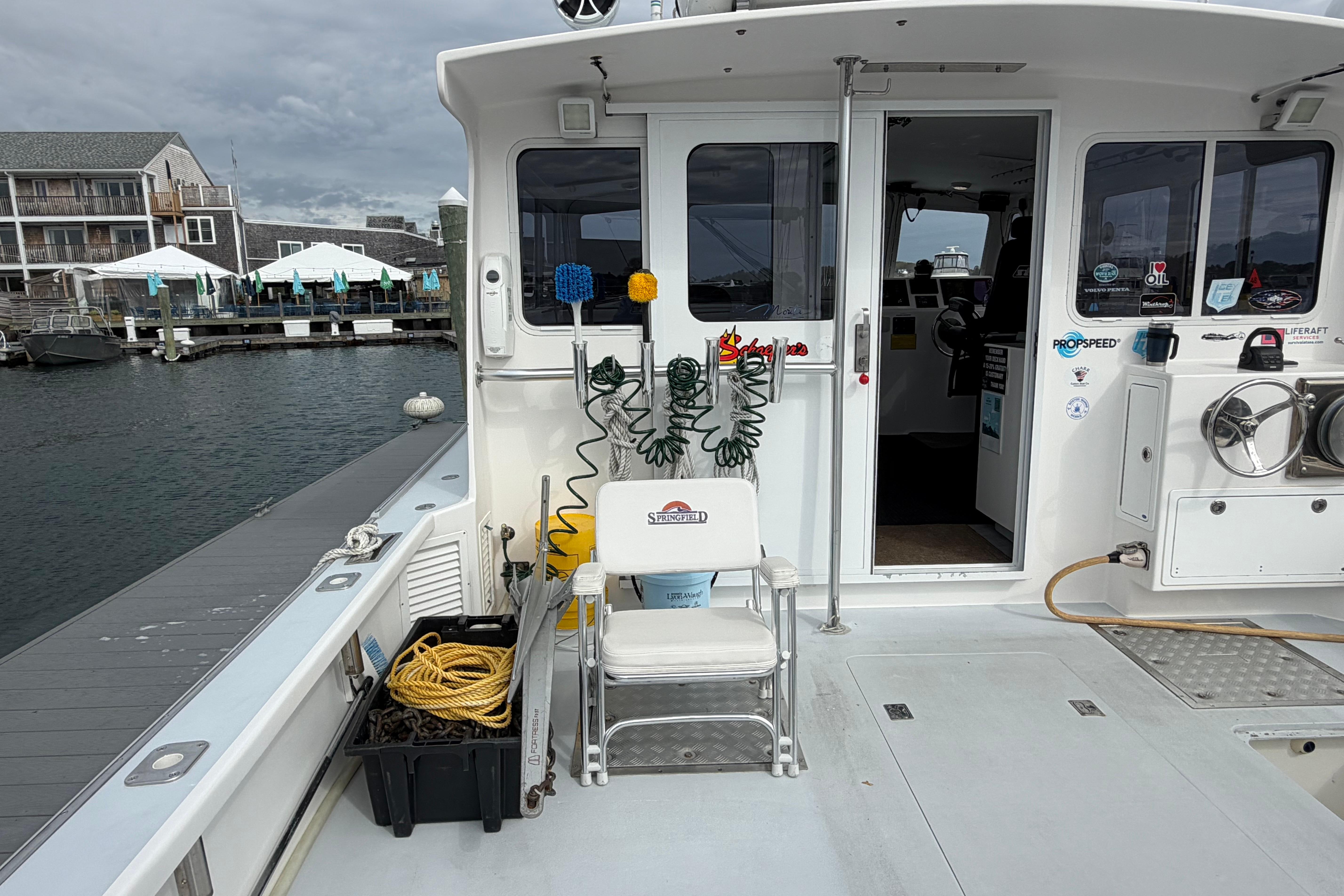 2018 H&H Marine Osmond Beal boat deck with equipment and marina view.