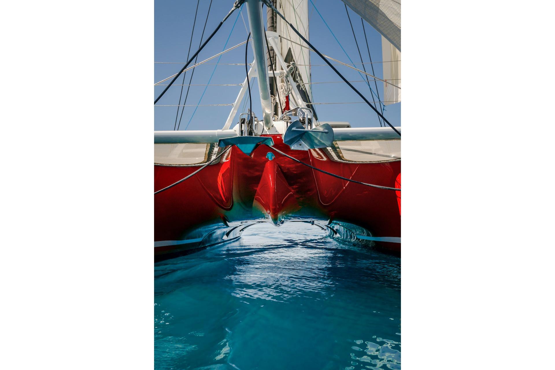 Red Privilege Signature 510 catamaran on blue water, 2025 model.