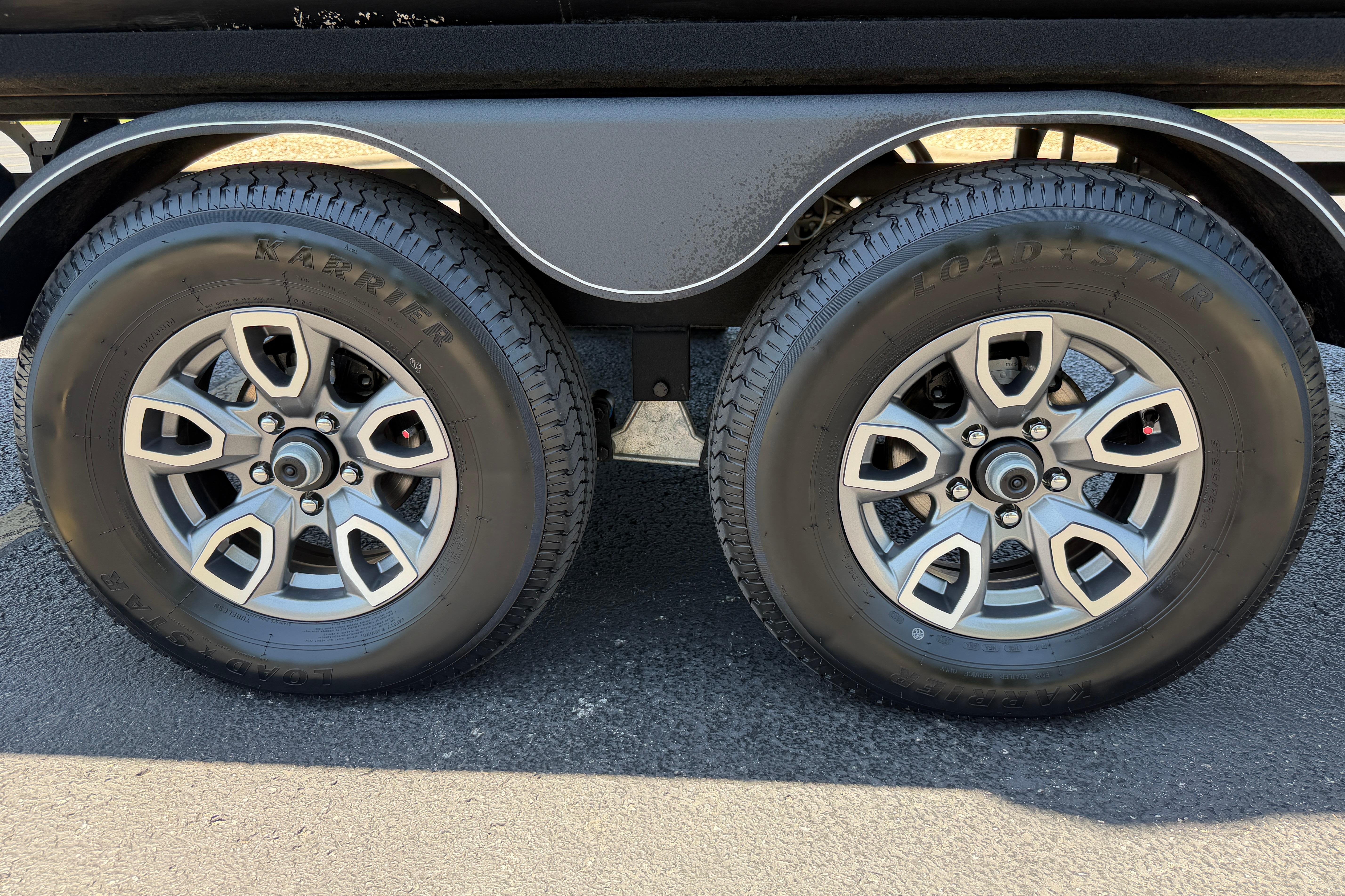 2024 Regency R250DL3 trailer wheels with Karrier Load Star tires on asphalt.