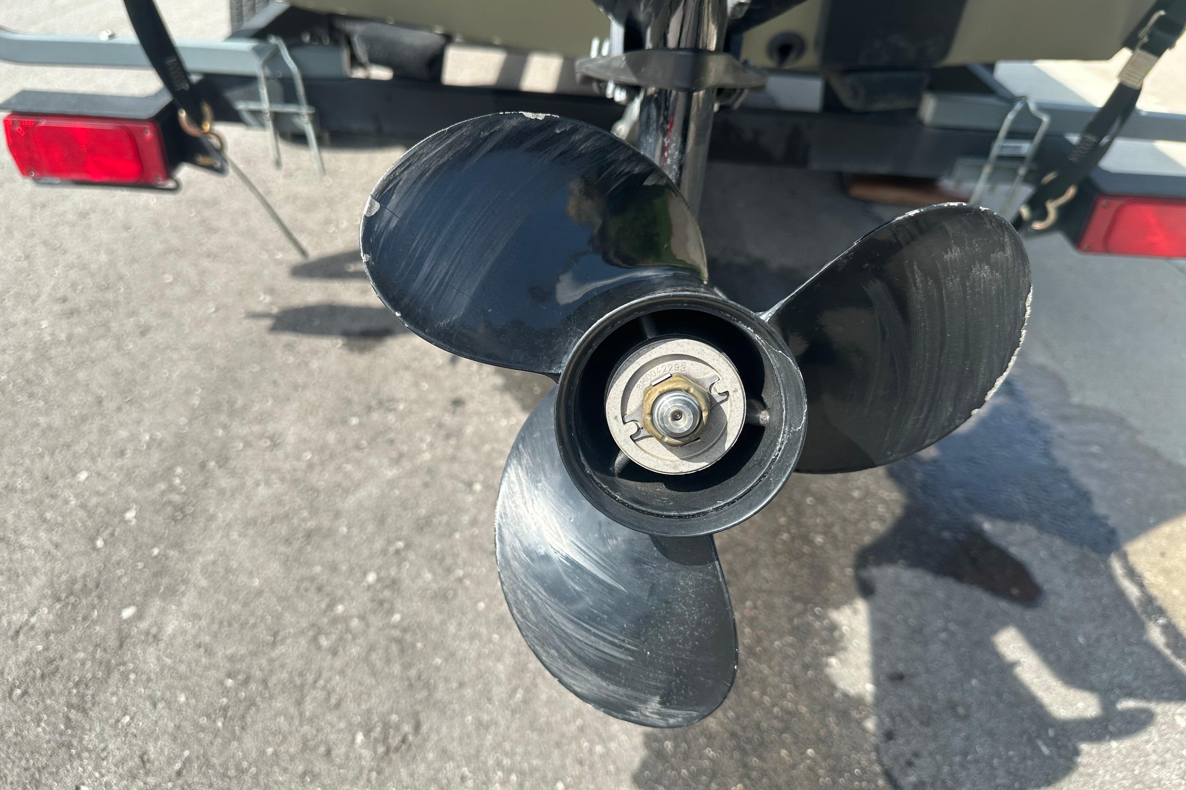 Propeller of 2024 Tracker Grizzly 1648 SC boat on trailer.