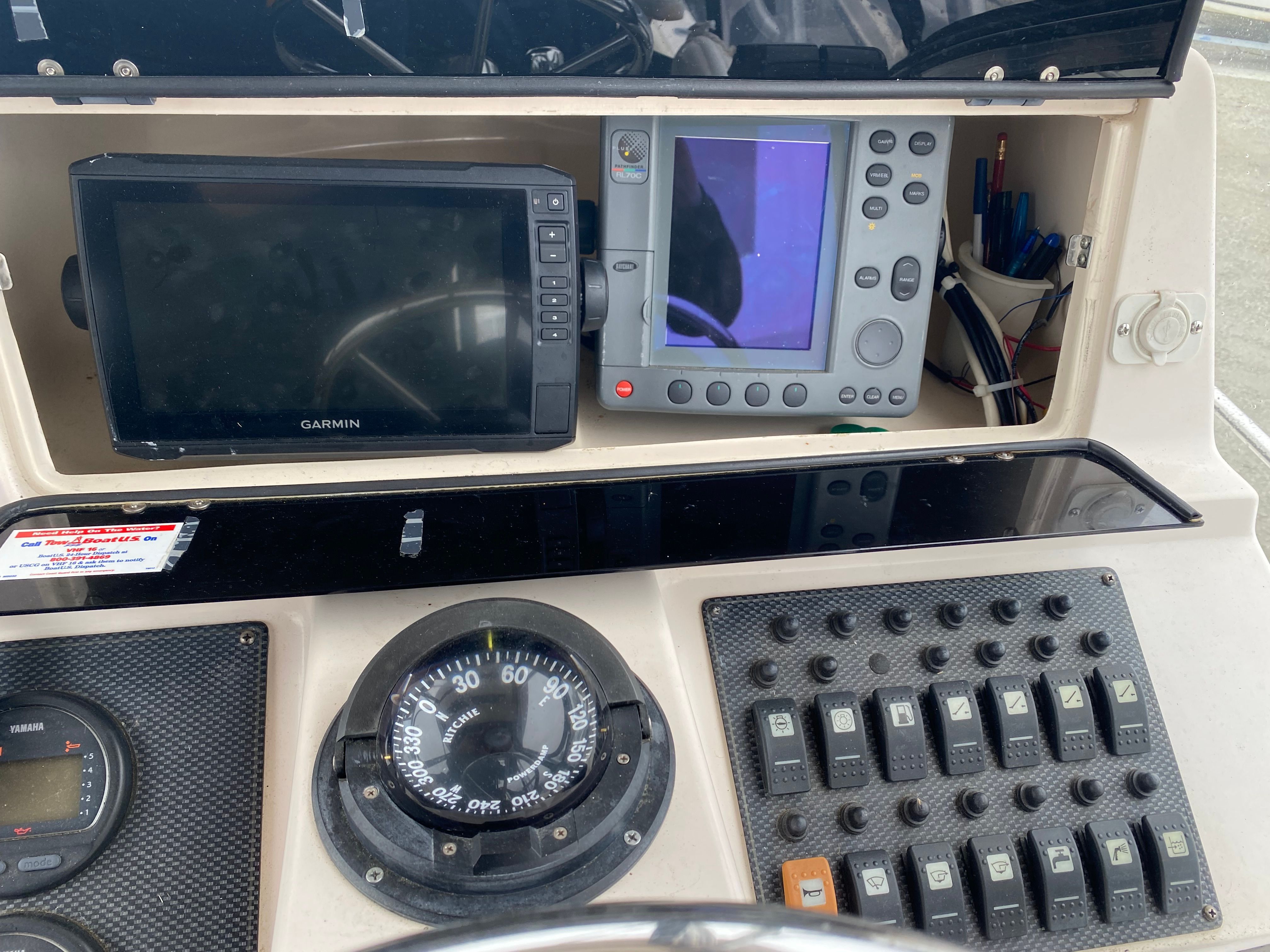The image shows the dashboard of a 2003 Grady-White Sailfish 282 boat with navigation equipment.