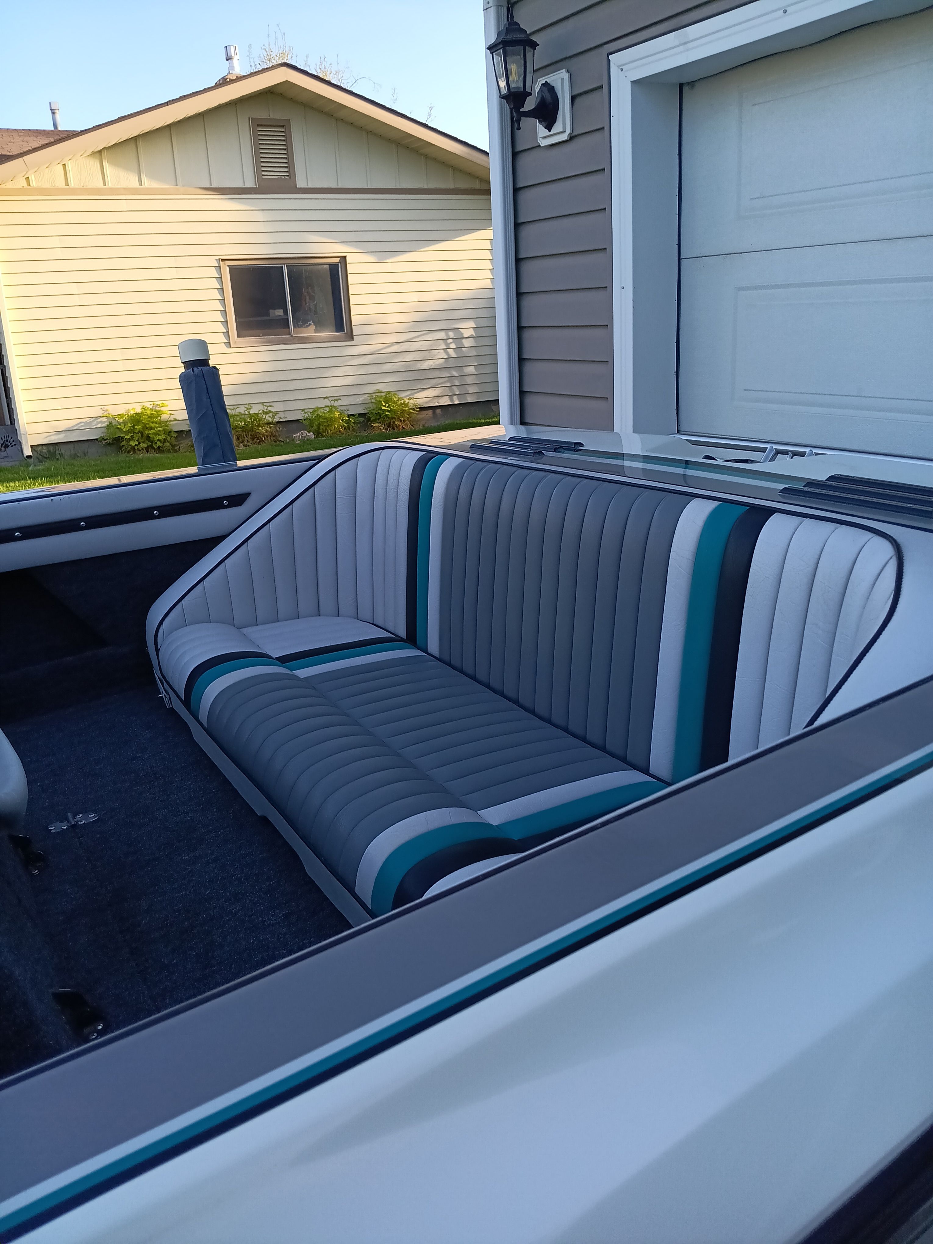 Interior of a 1991 Malibu Skier boat with striped seats.