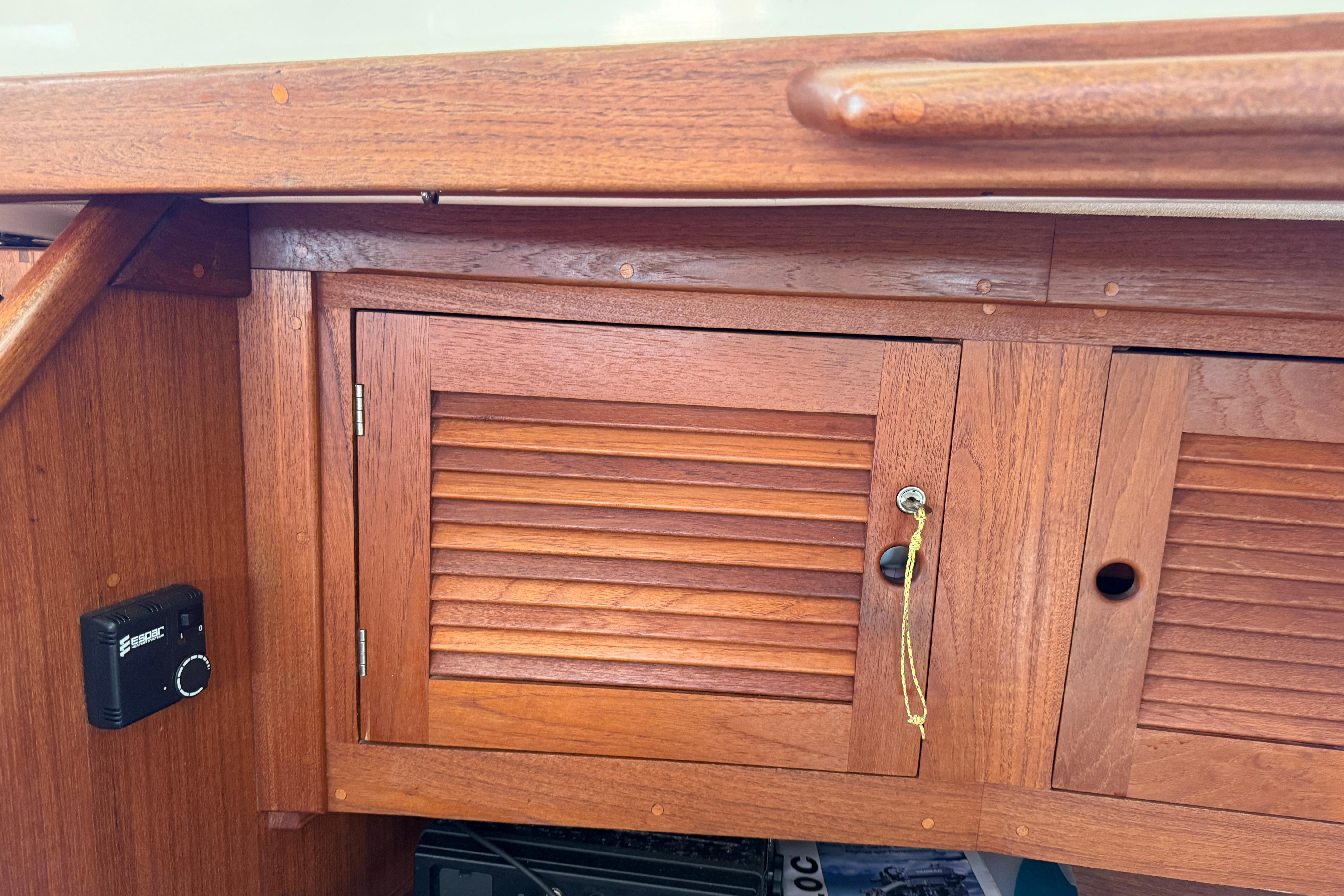Wooden cabinet on a 1997 Tartan 3800 sailboat interior.