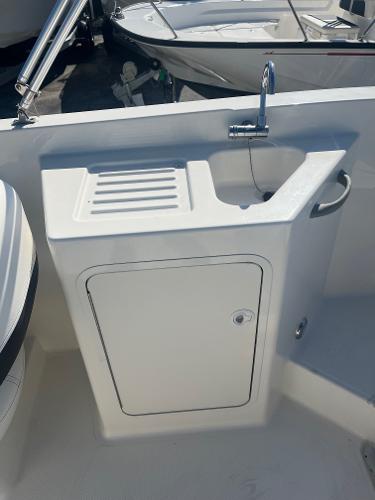 2021 Bayliner DX 2200 boat sink and storage compartment.
