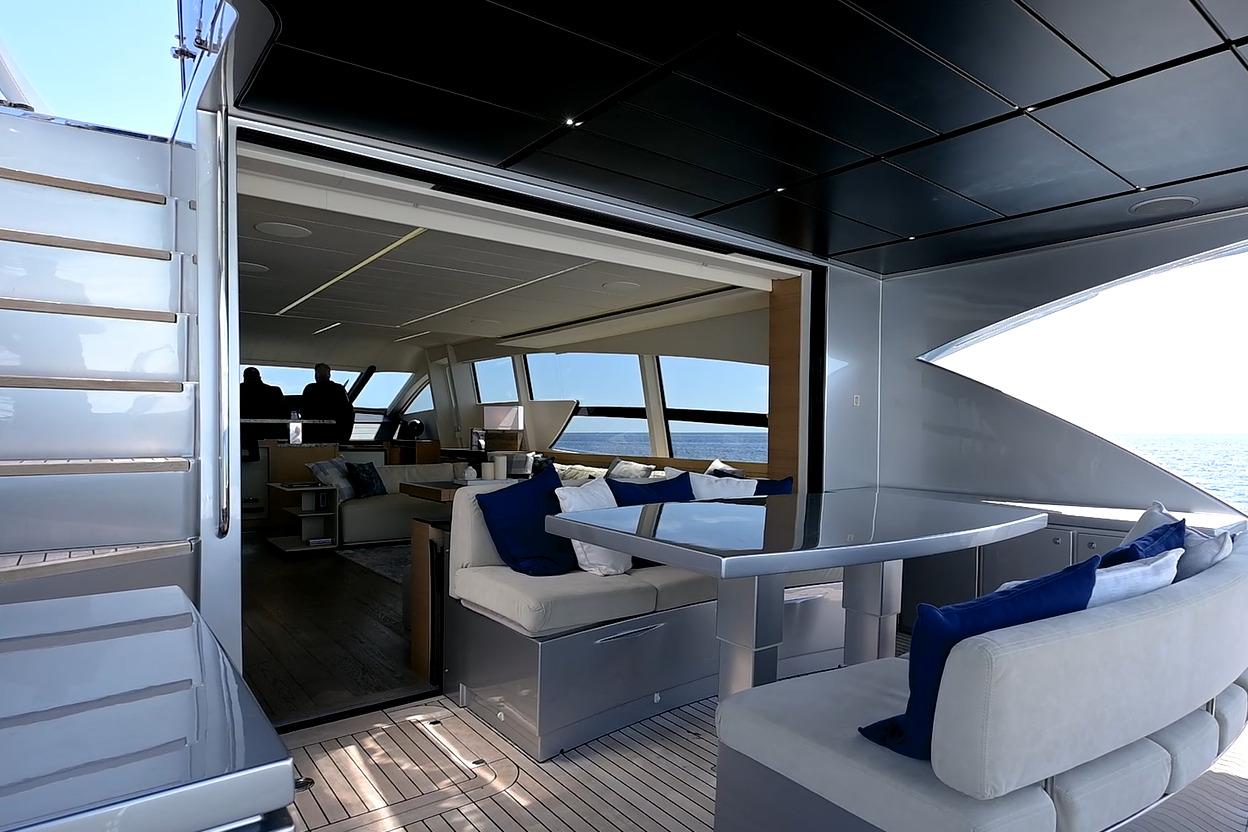 Luxurious interior of 2015 Pershing 92 yacht with elegant seating and ocean view.