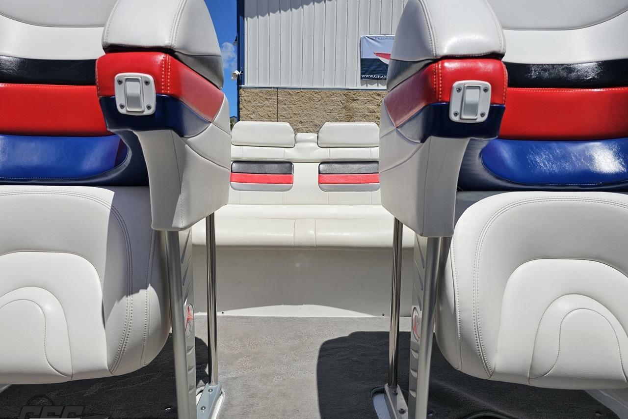 Interior of a 2005 Formula 271 FASTech boat with red, white, and blue seating.