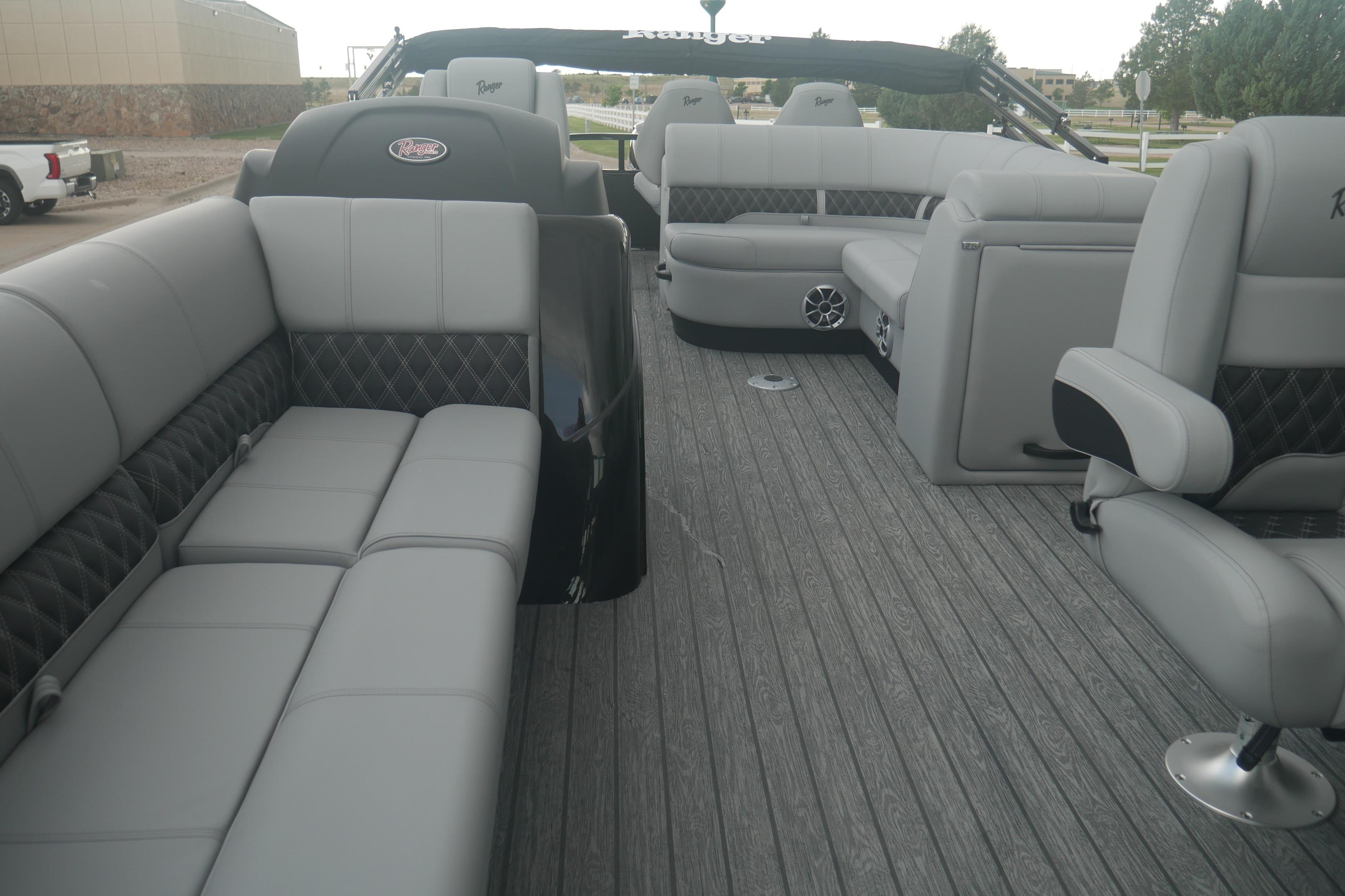 Luxurious interior of 2026 Ranger 220FC boat with plush seating and modern design.