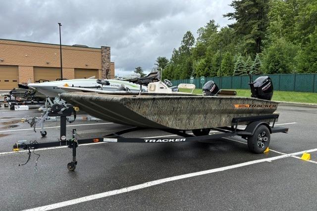 2026 Tracker Grizzly 1756 T Marsh boat on trailer in parking lot.