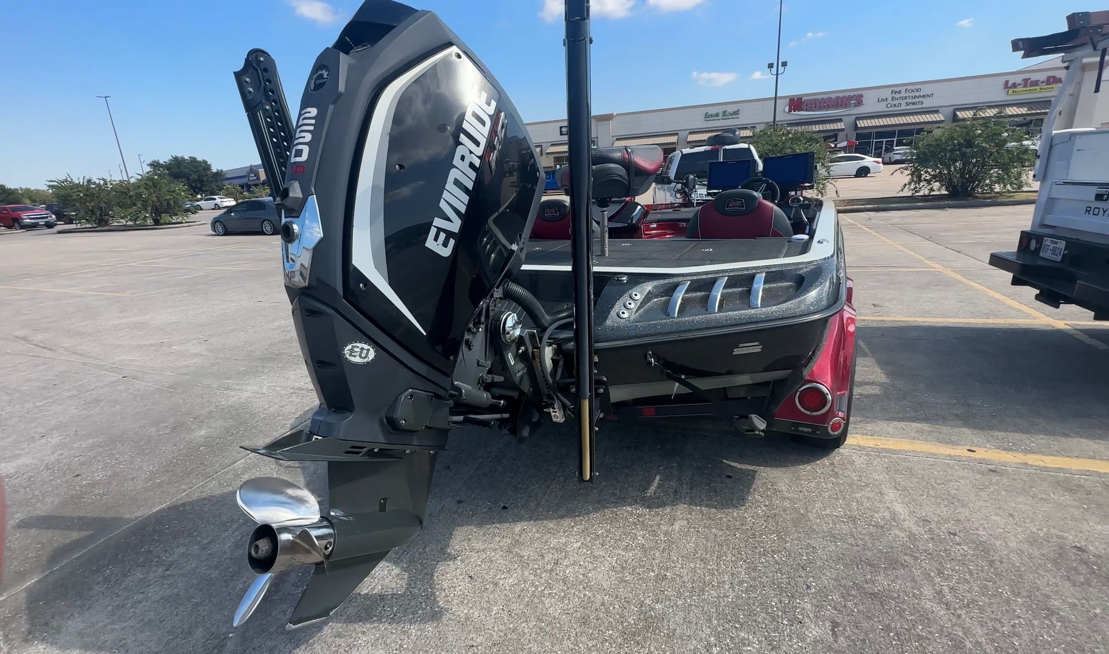 Ranger 520C boat with Evinrude engine in parking lot, 2017 model.