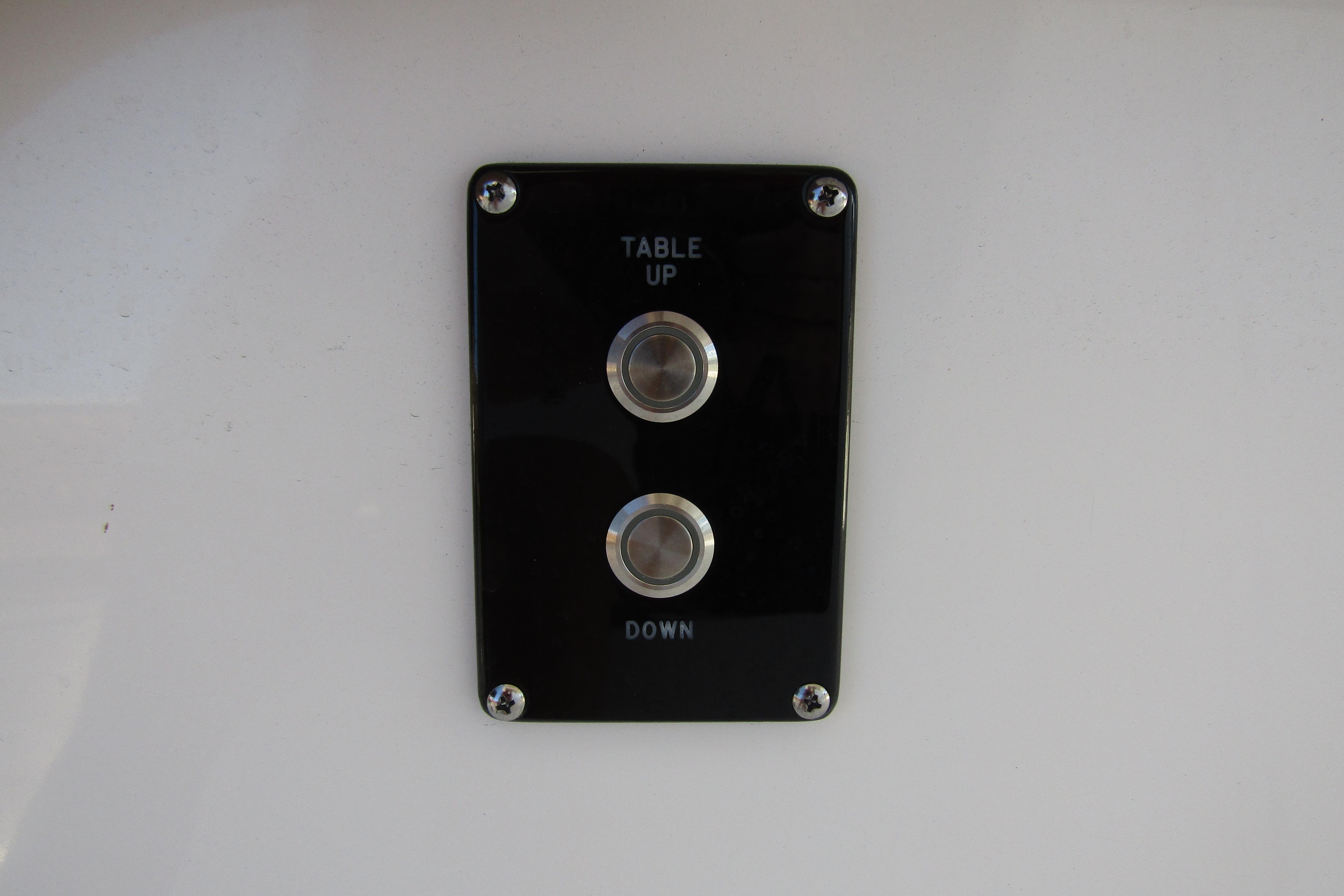 Control panel with "Table Up" and "Down" buttons on 2025 Sea Pro 322 Offshore.