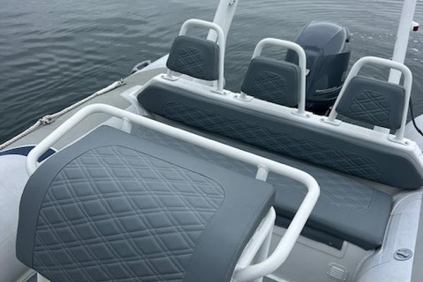 2017 Highfield OM 500 boat interior with gray diamond-stitched seats.