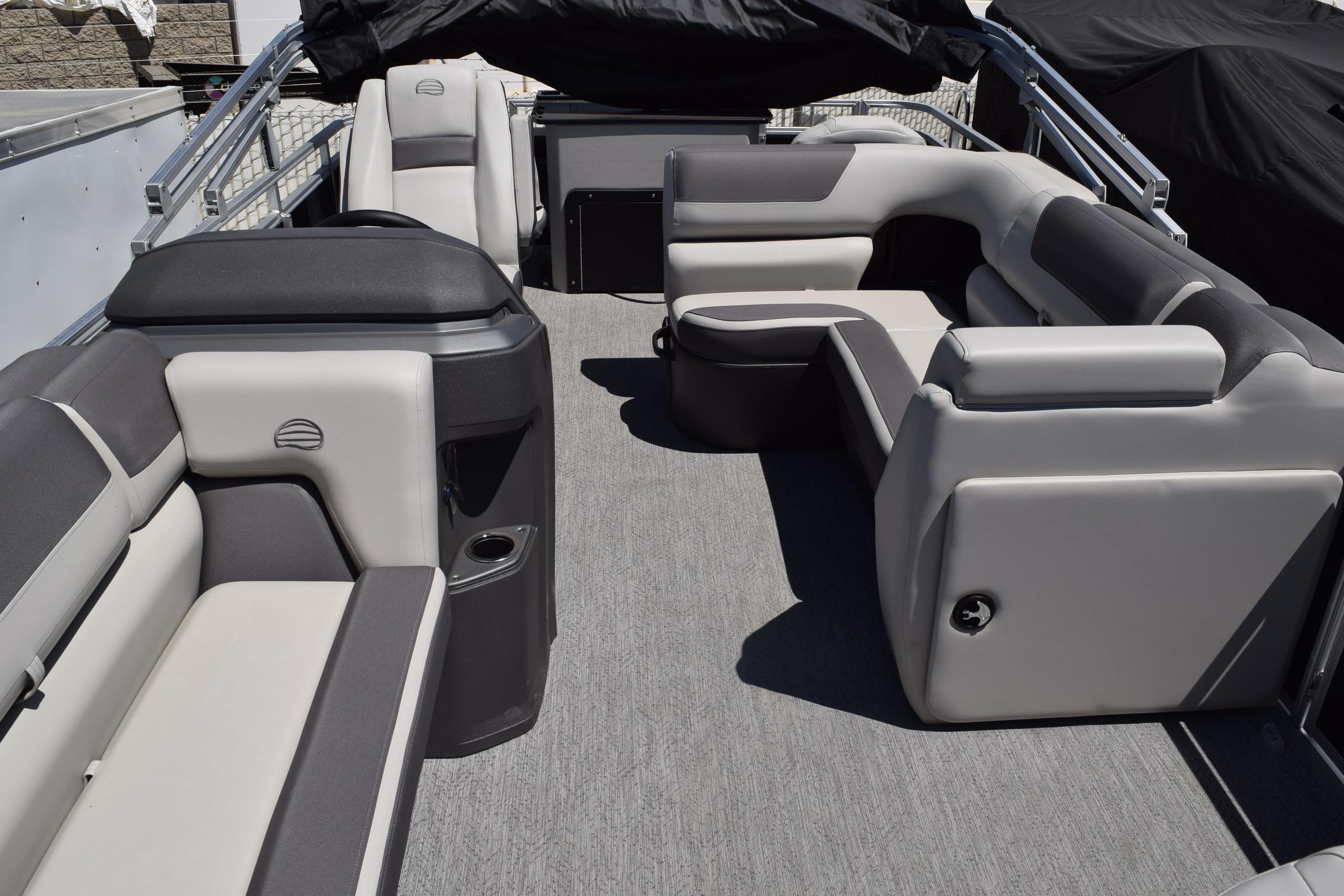 2026 Sun Tracker Fishin' Barge 20 DLX interior with spacious seating and modern design.