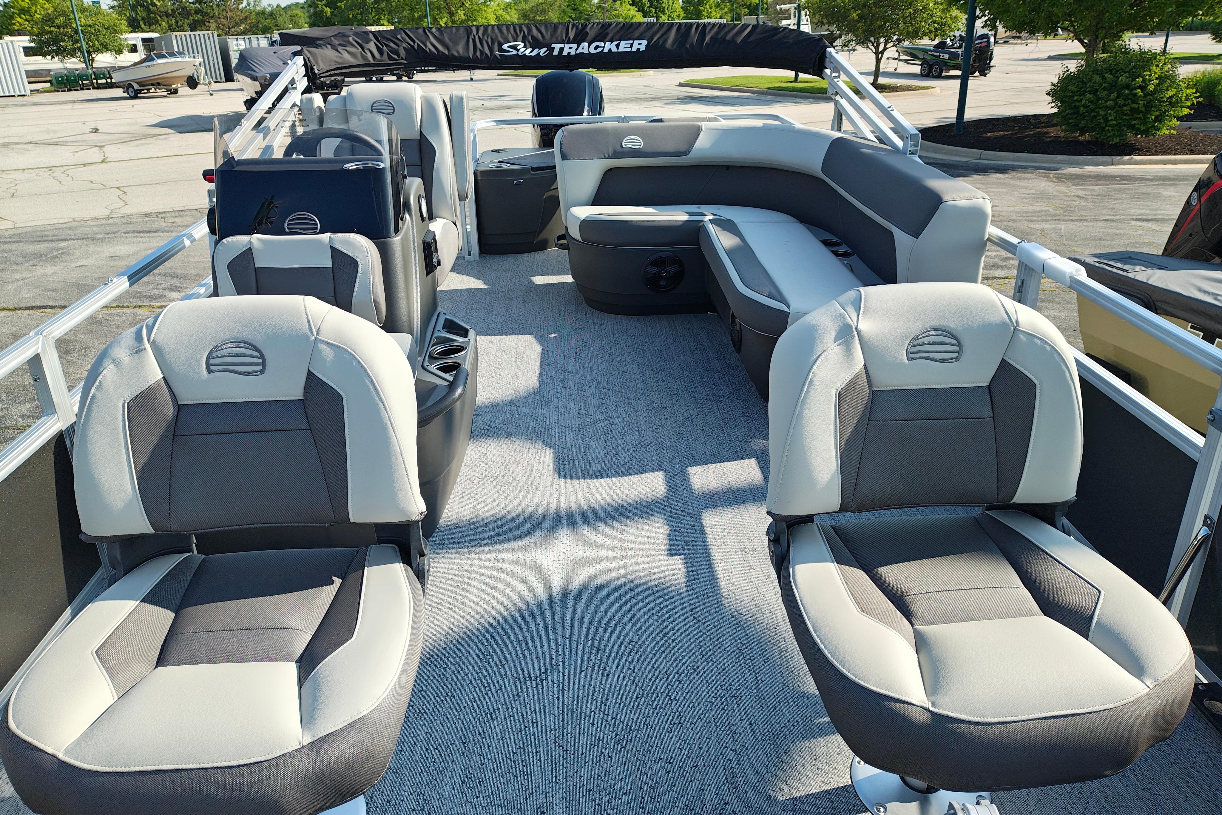 2026 Sun Tracker Bass Buggy 18 DLX pontoon boat interior with plush seating and spacious layout.