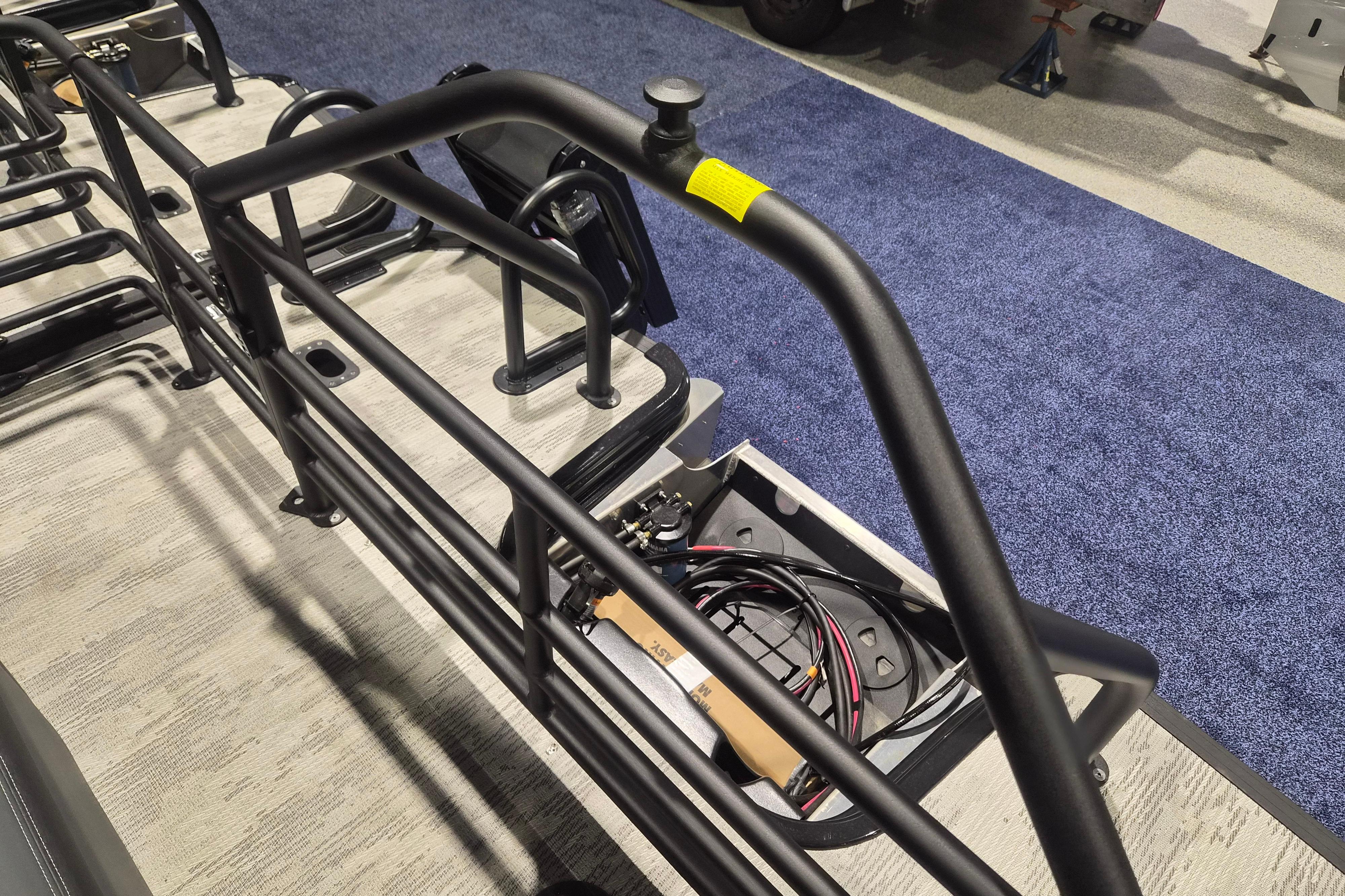 2026 Sylvan L3 ULZ boat interior with metal railings and exposed wiring.