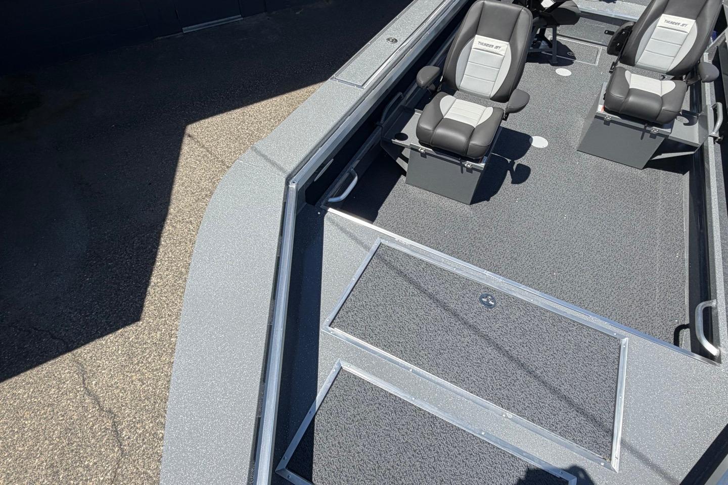 2026 Thunder Jet 209 Rush OT boat interior with seating and storage compartments.