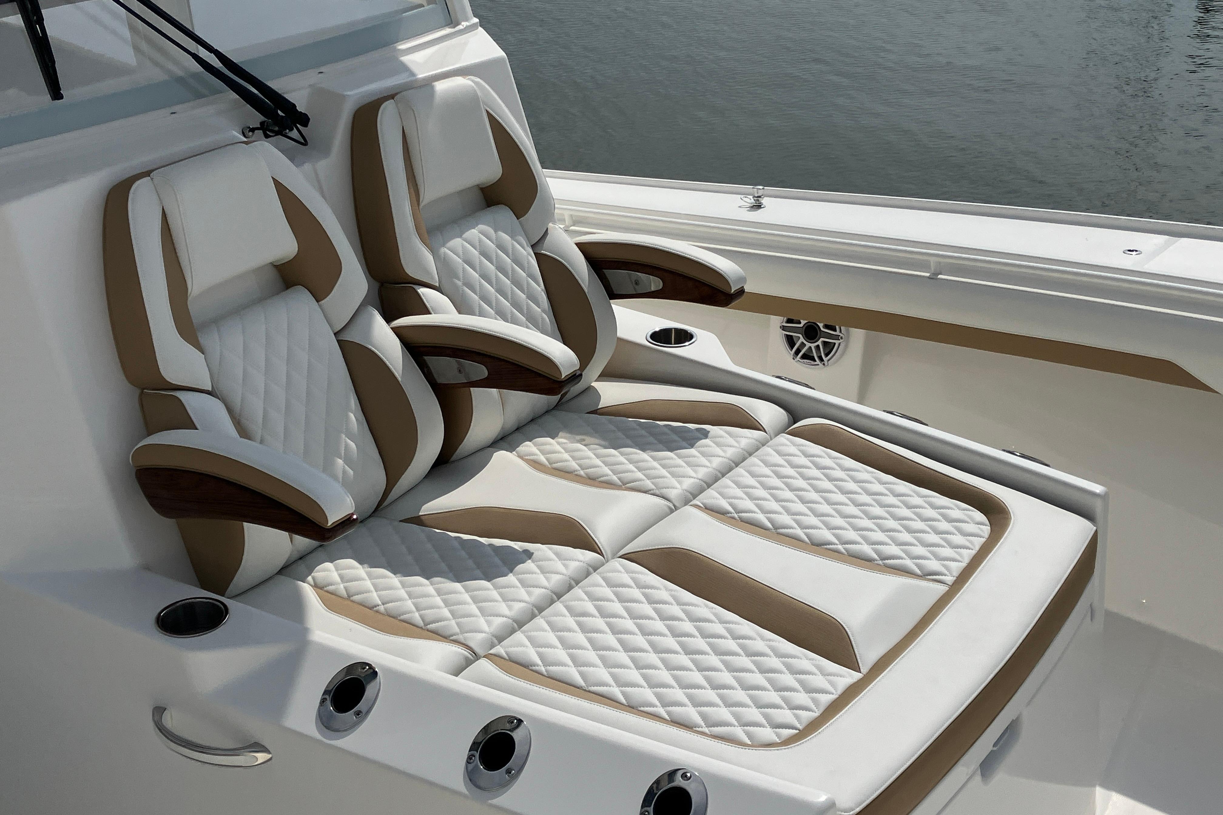Luxurious seating on 2027 Regulator 35 boat, featuring quilted upholstery and armrests.