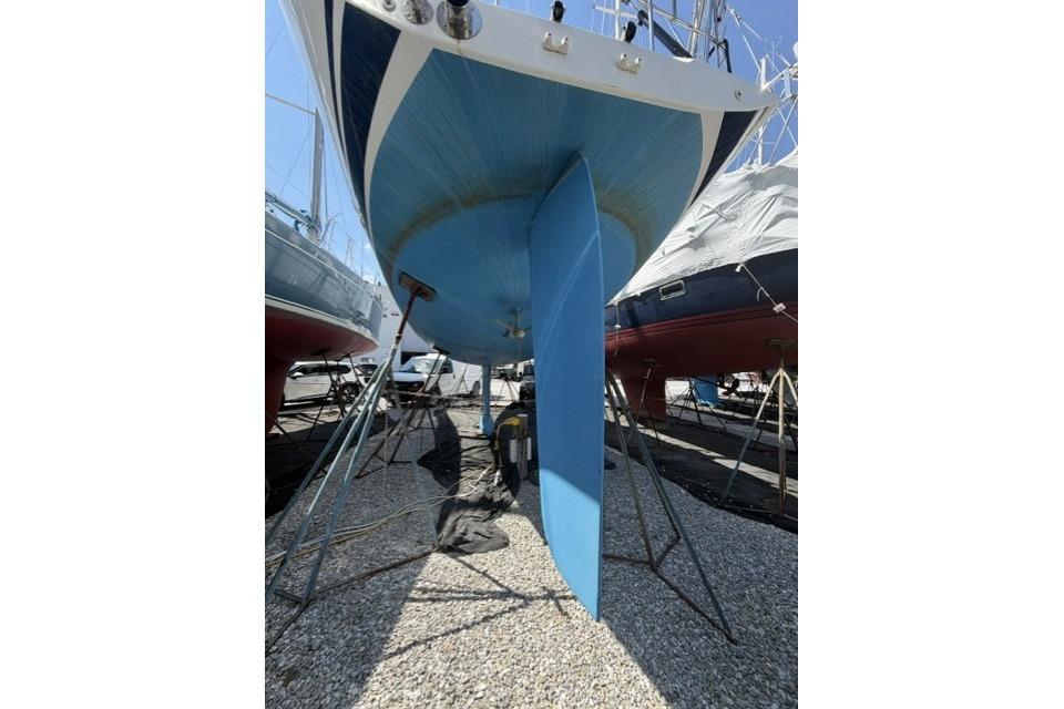 2002 Saga 43 sailboat on dry dock, showing keel and hull.