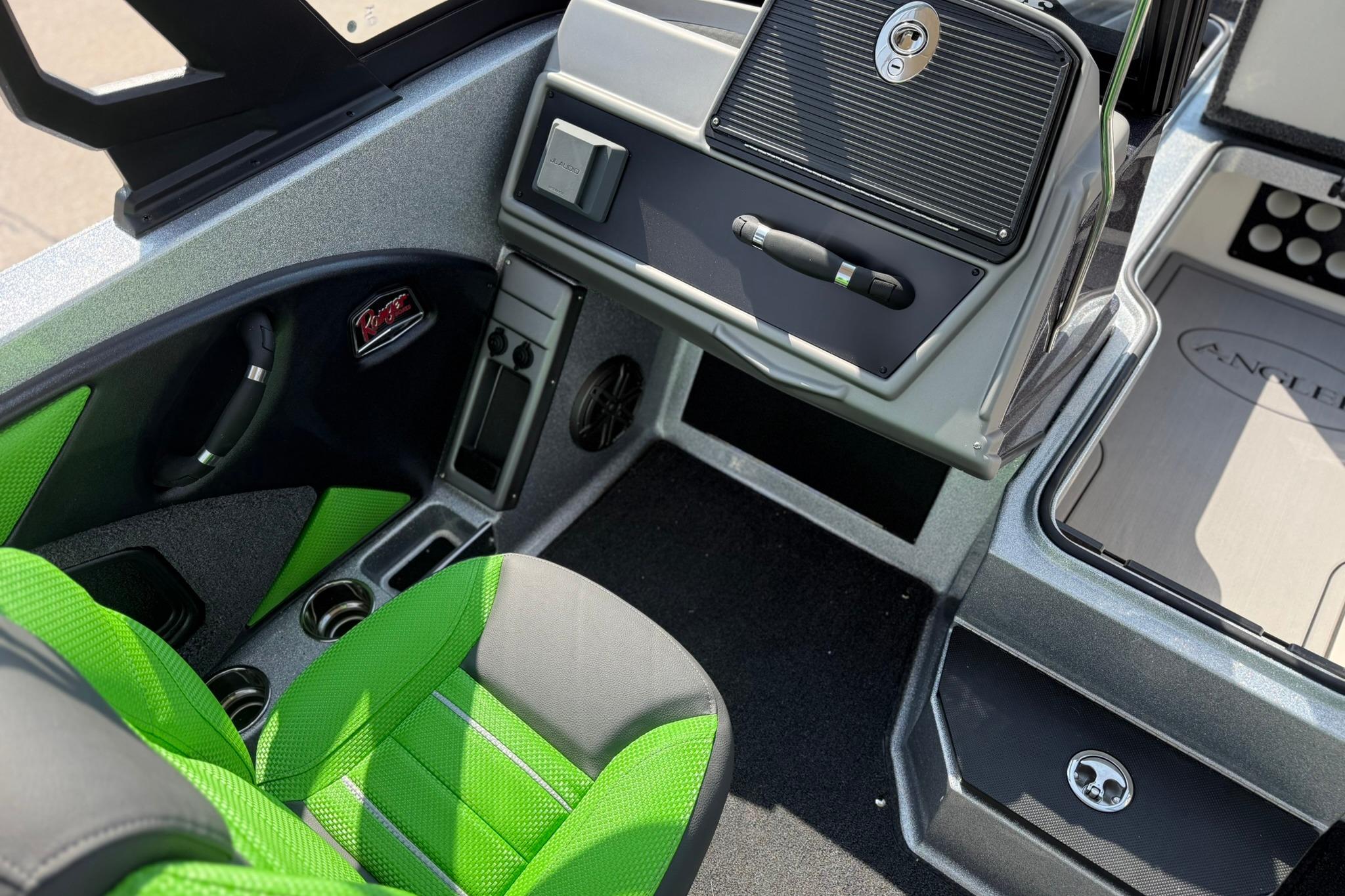 Interior of 2026 Ranger 1880MS boat with green seating and modern dashboard.