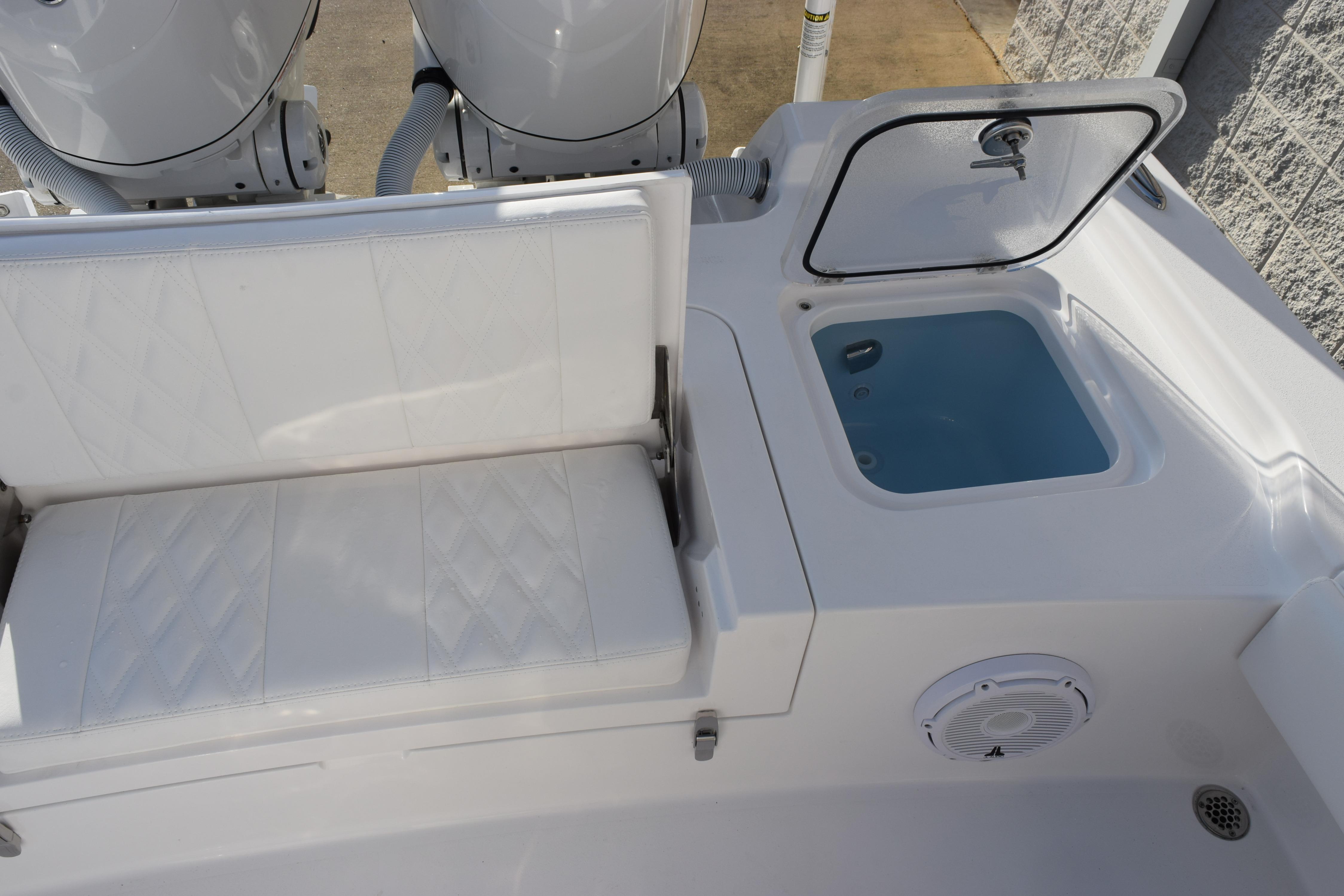 2026 Contender 29 Bay boat interior with seating and storage compartment.