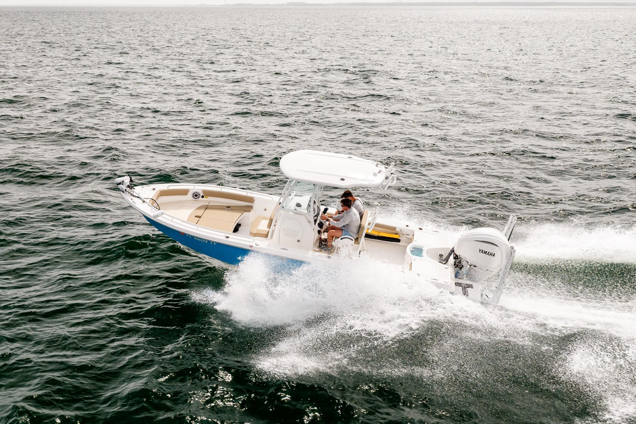 2023 Everglades 243 Center Console boat cruising on open water.