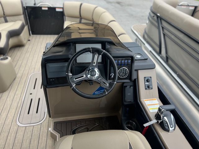 Interior view of 2023 Veranda VP22RCT pontoon boat with helm console.