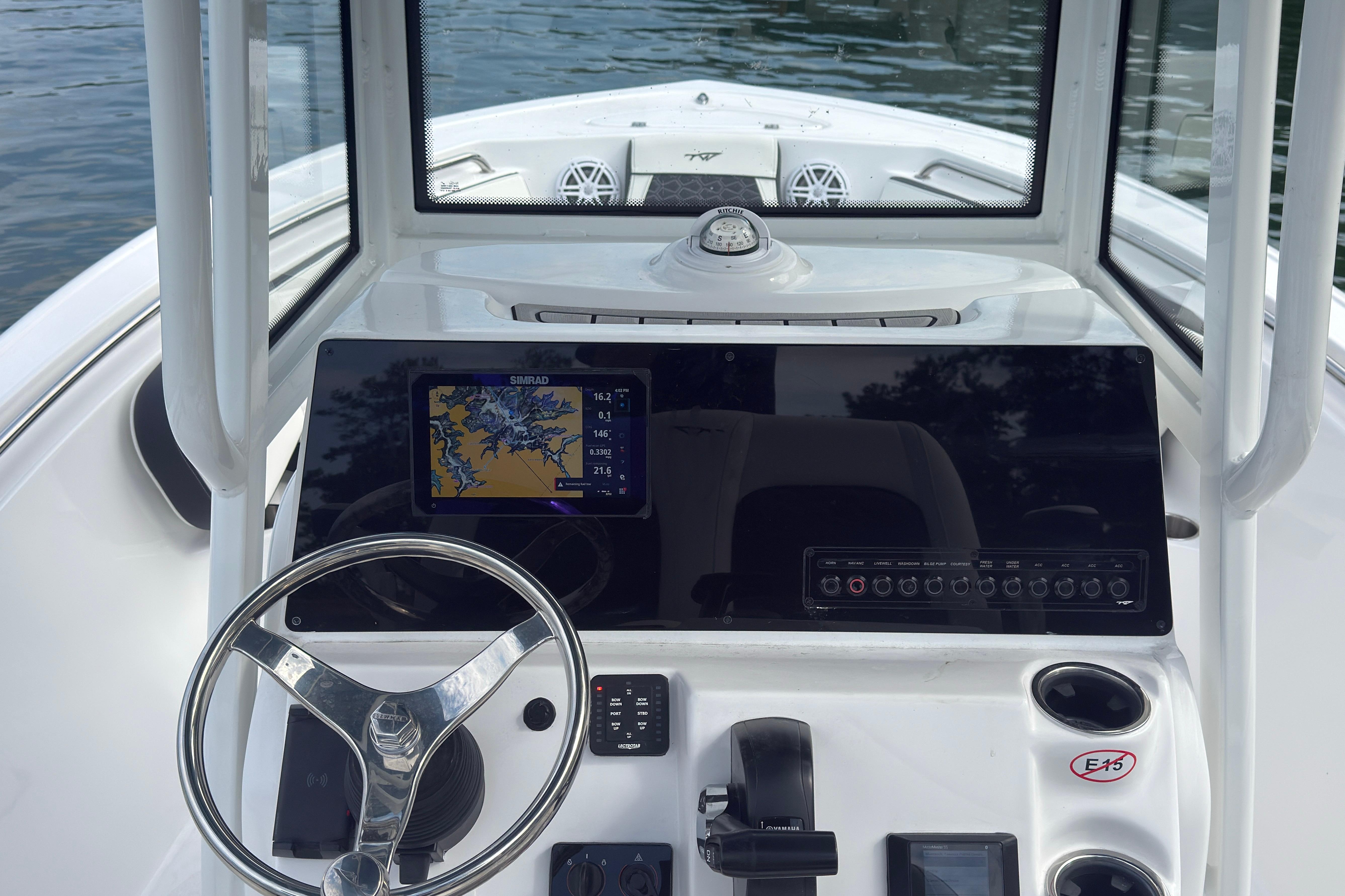 2026 Tidewater 210 CC Adventure boat dashboard with navigation system and steering wheel.