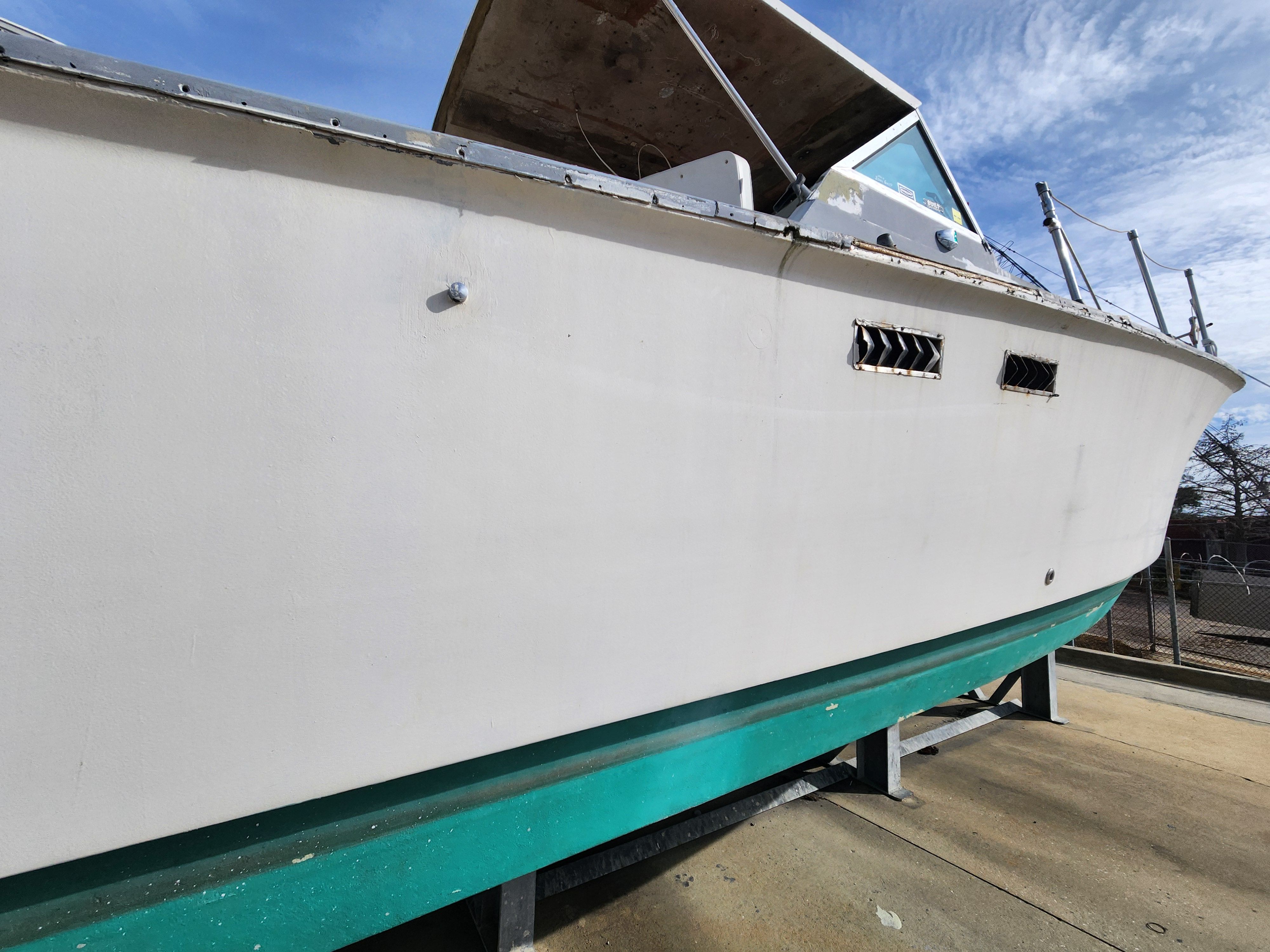 1967 Hatteras 28ft boat on a dry dock.