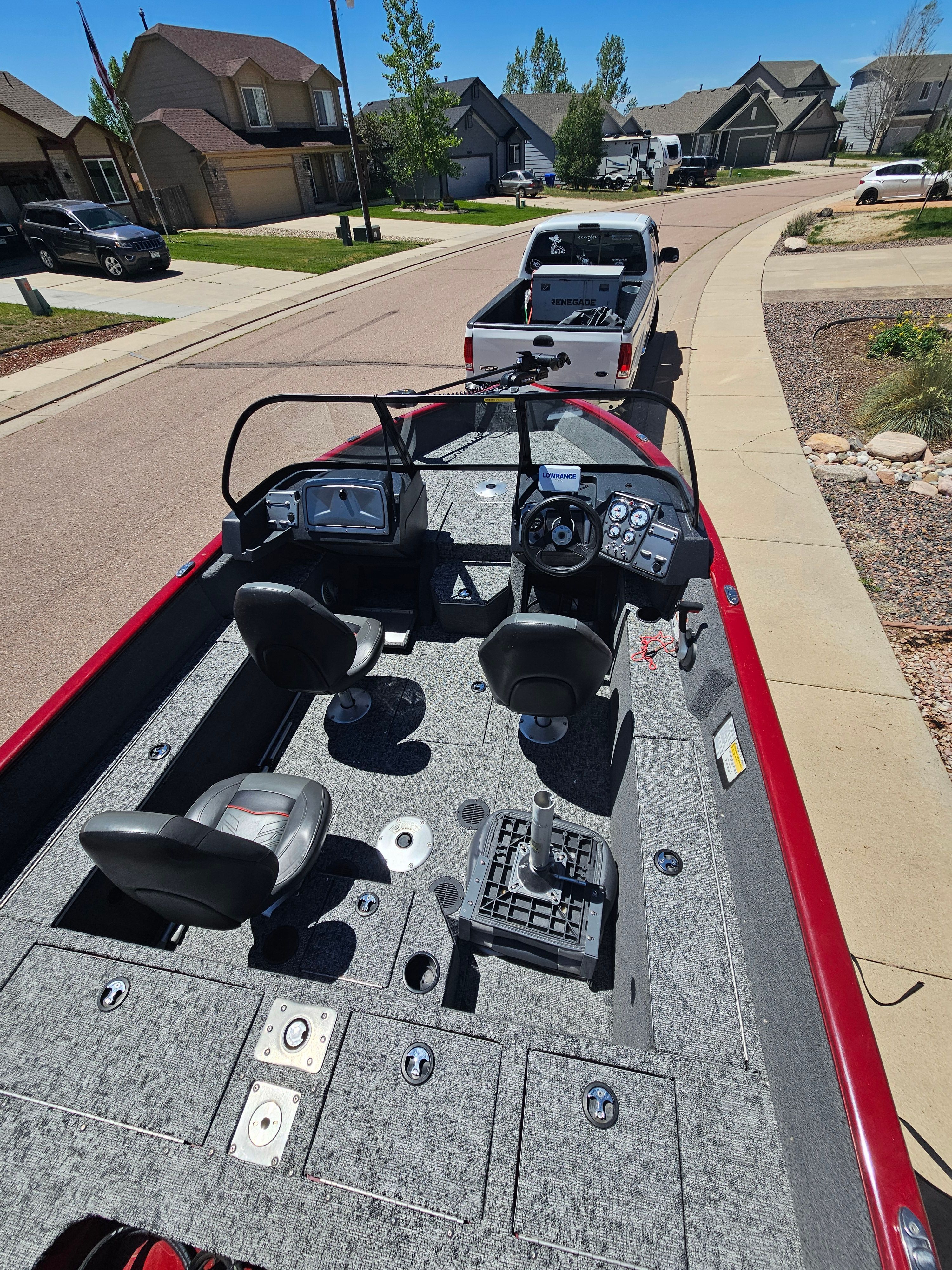 2021 Tracker Pro Guide V-175 WT on trailer in residential area.