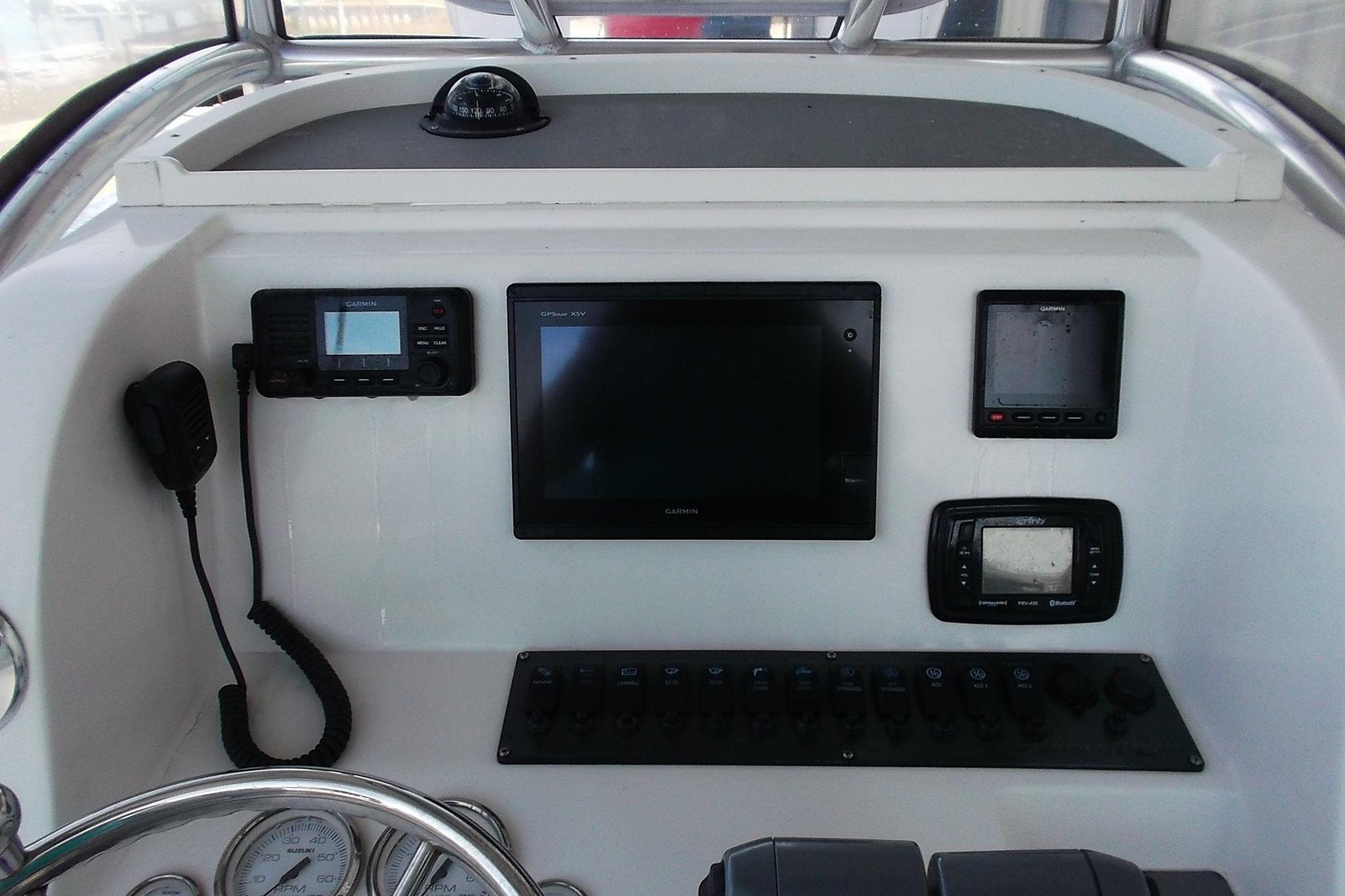 2018 Twin Vee 260 CC SE boat dashboard with navigation and communication equipment.