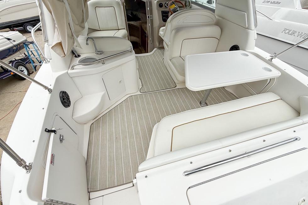 1999 Sea Ray 290 Sundancer boat interior with seating and table.