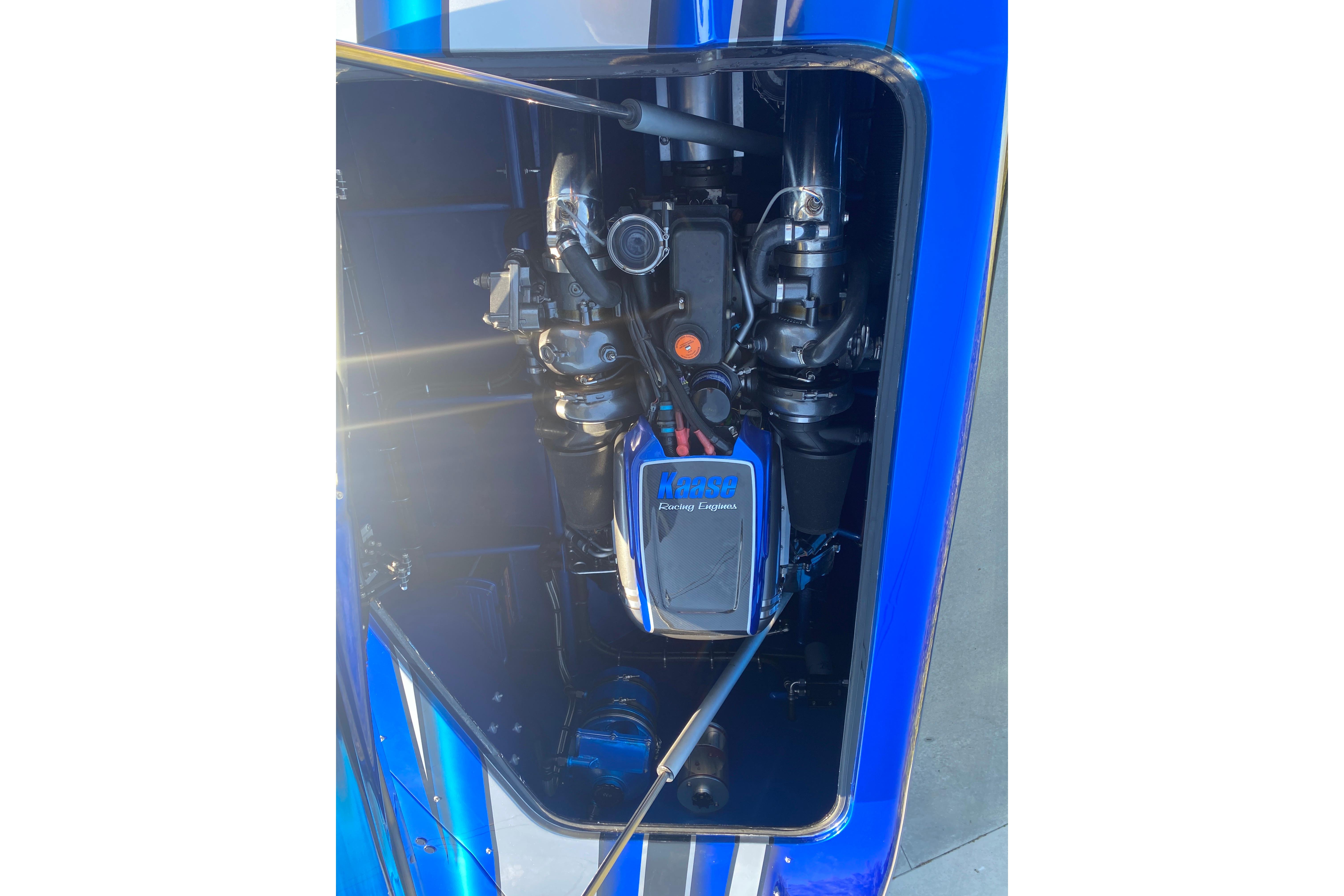 Engine compartment of a 2016 MTI 44 RP boat, featuring a high-performance engine.
