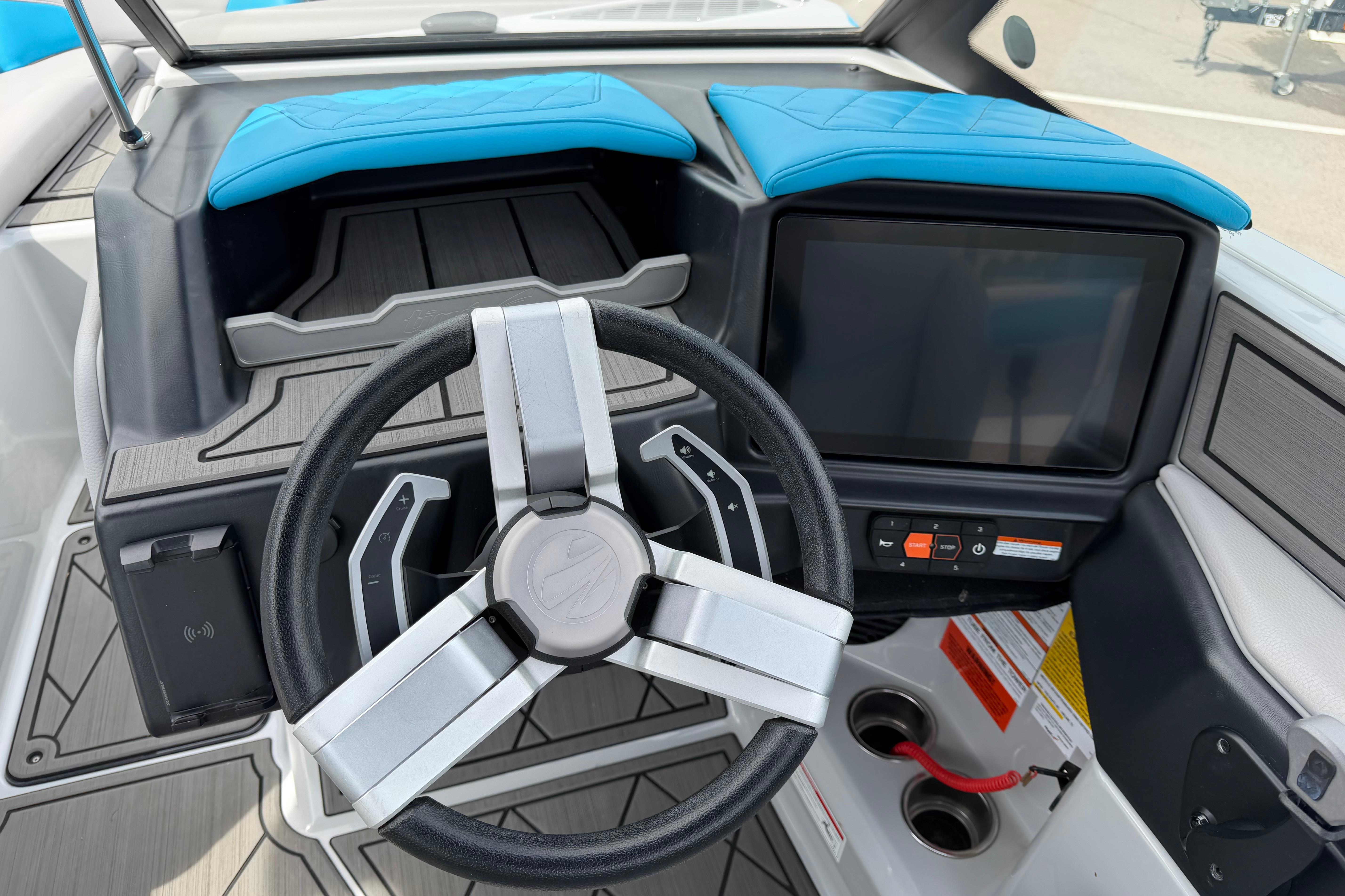 2024 Tigé Z1 boat dashboard with modern steering wheel and touchscreen controls.