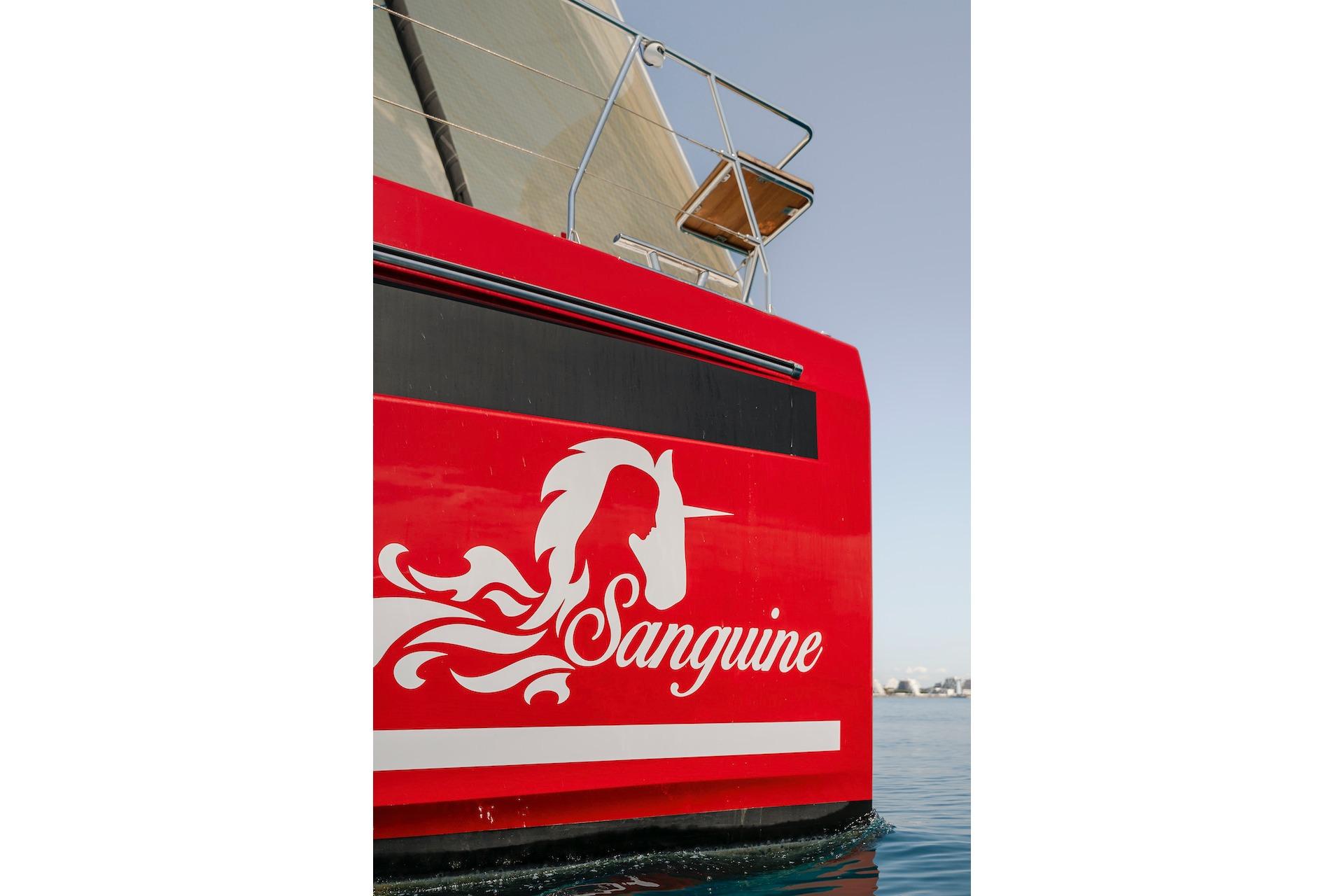 Red Privilege Signature 510 sailboat, 2025 model, featuring unicorn design.