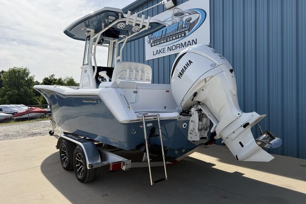 2026 Tidewater 232 LXF boat with Yamaha engine on trailer at dealership.