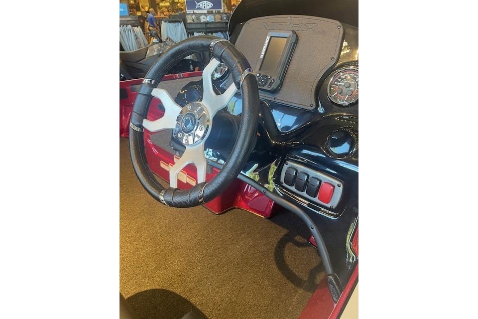 Steering wheel and dashboard of 2026 Nitro Z17 boat, featuring modern controls and display.