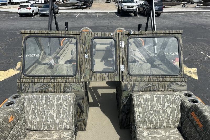 2026 SeaArk EasyCat boat with camouflage design, parked in a lot.