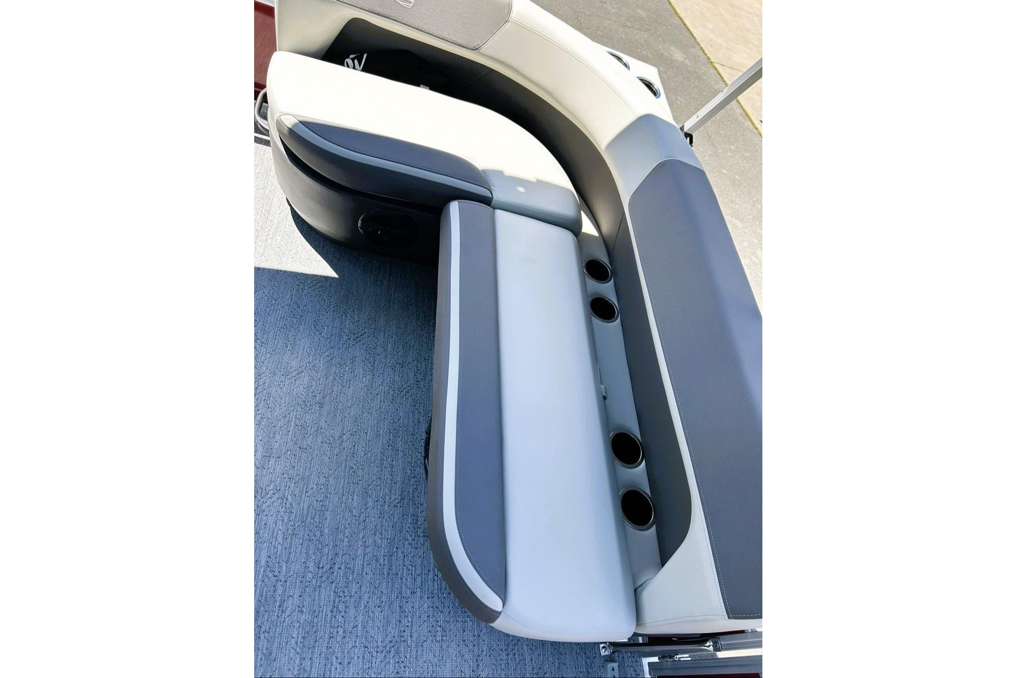 2026 Sun Tracker Bass Buggy 16 XL Select boat seating with cup holders, gray upholstery.