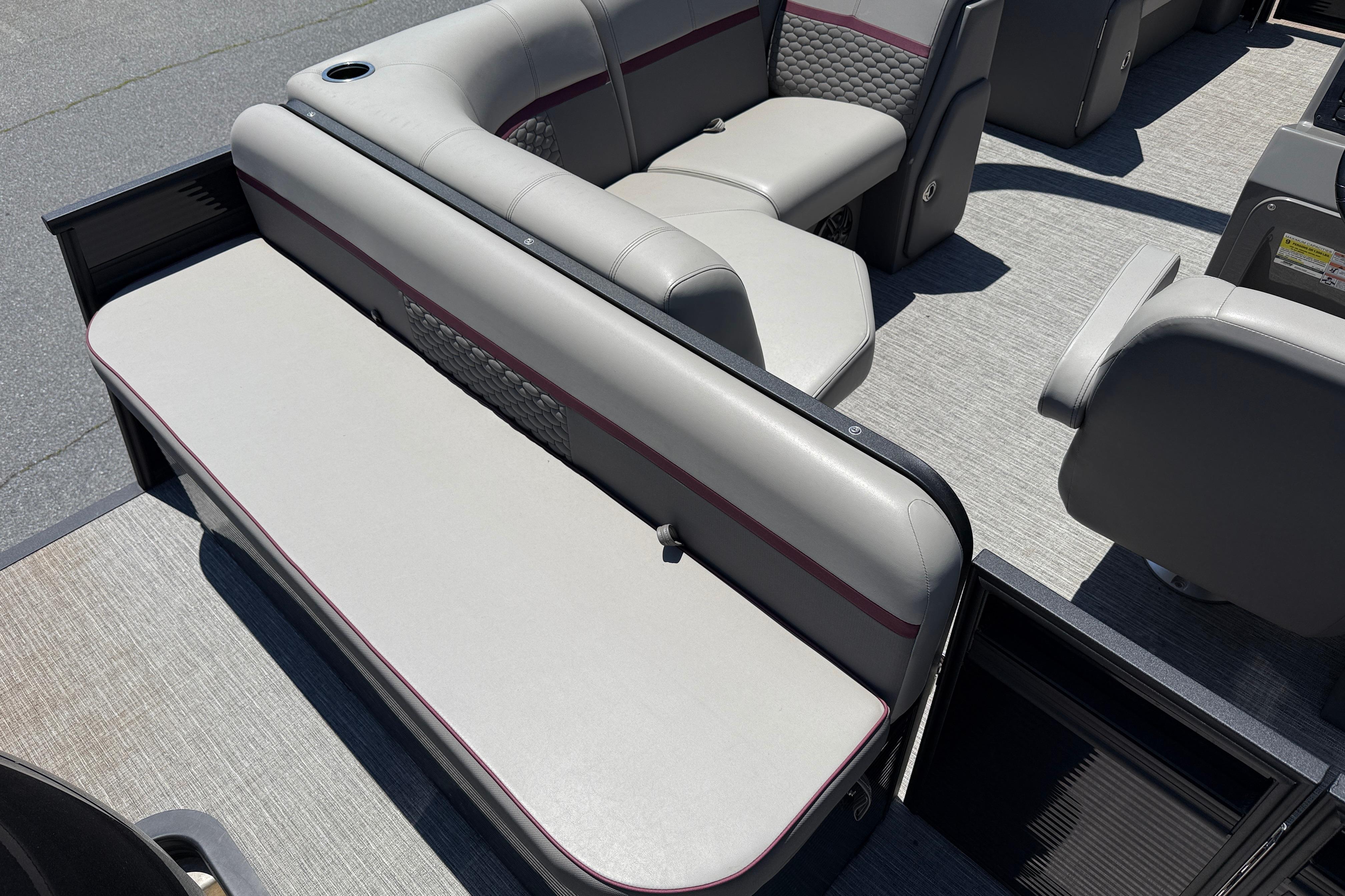 2023 Apex 818 boat interior with gray seating and modern design.