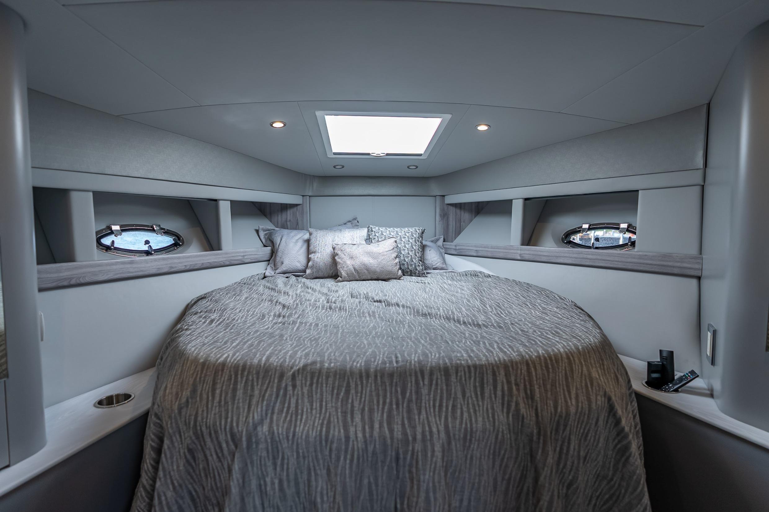 Luxurious interior of 2022 Formula 40 Performance Cruiser with elegant bedding and modern design.