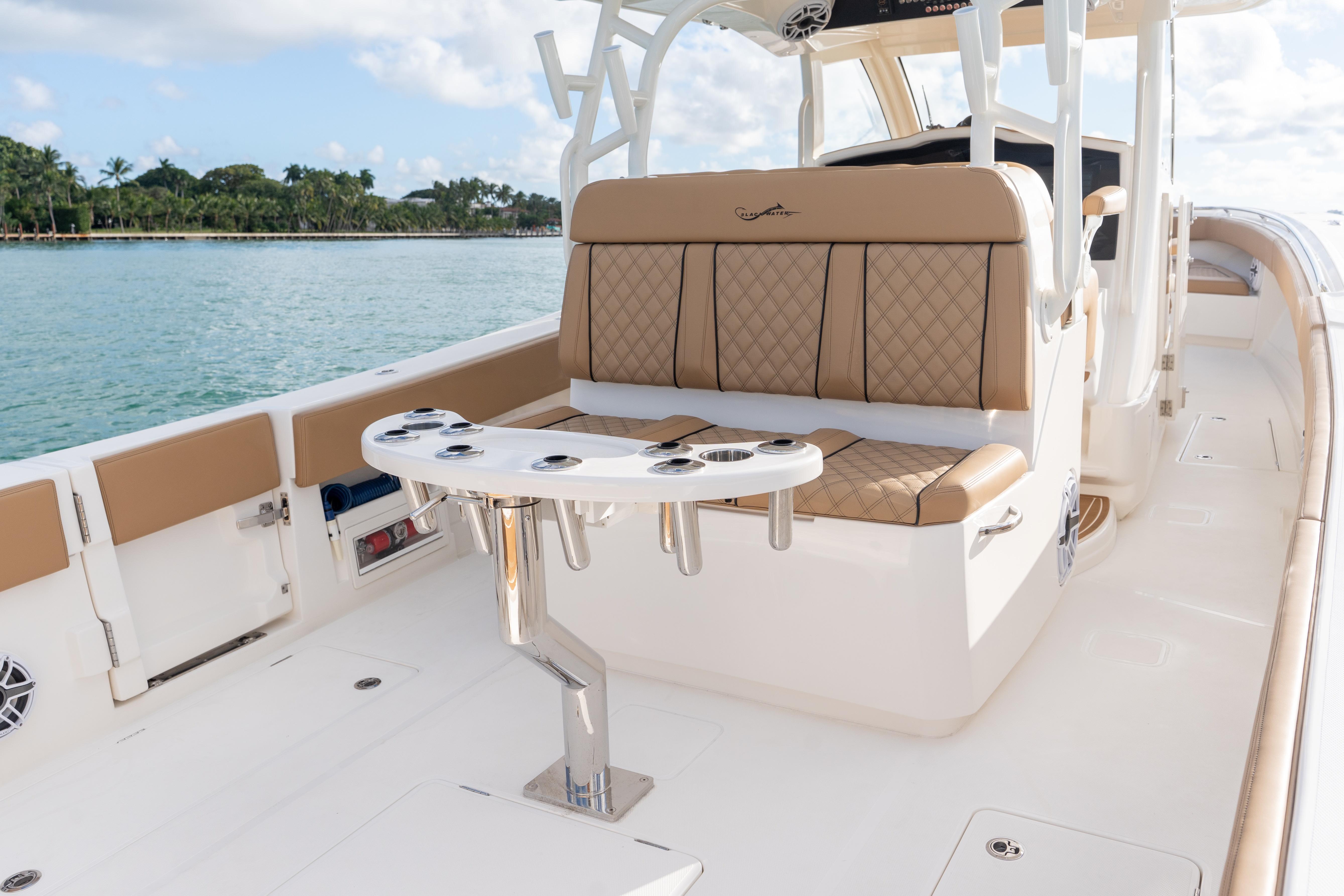 2026 Blackwater 41 Performance Fish boat interior with tan seating and rod holders.