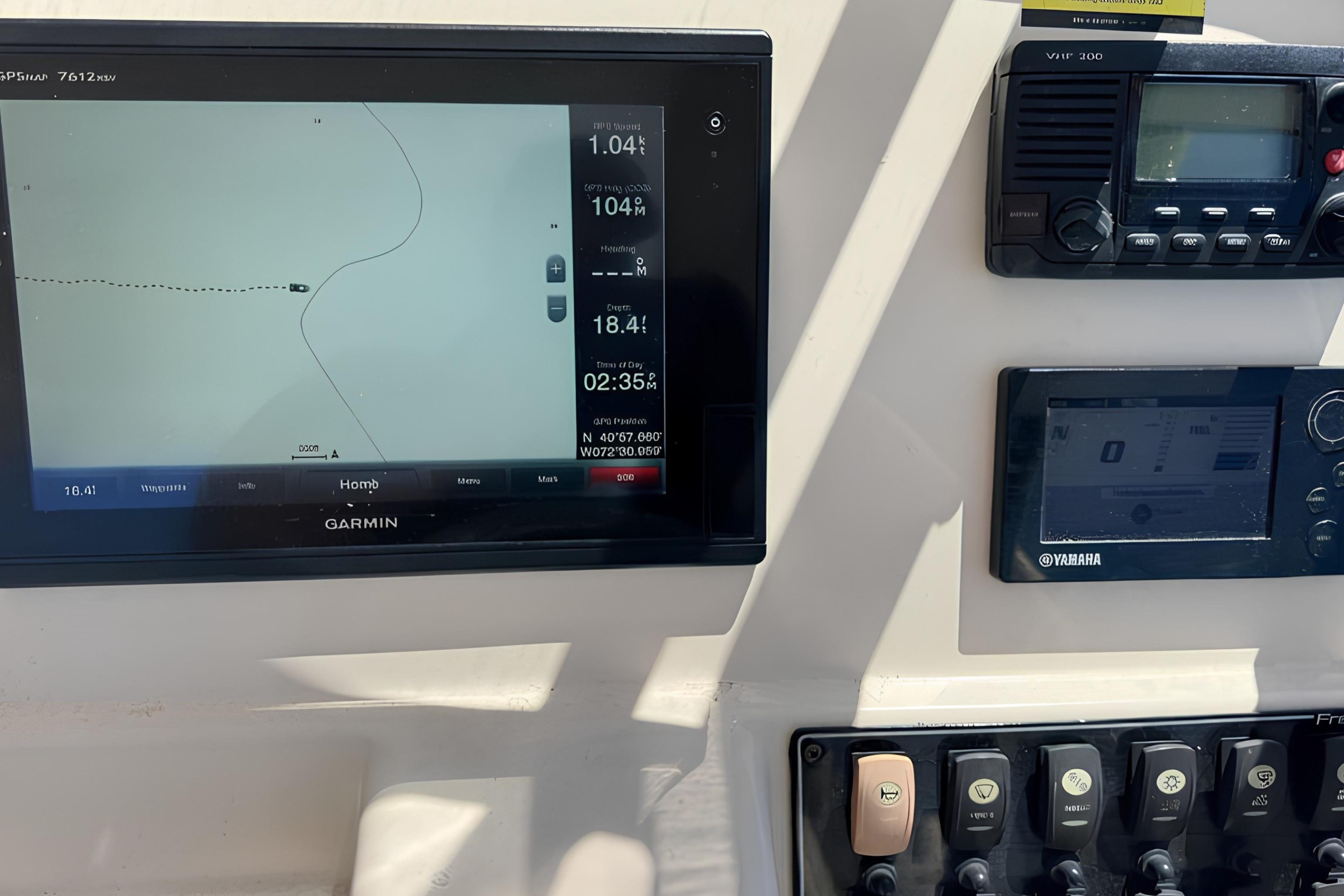 Dashboard of a 2017 Grady-White Freedom 235 boat with navigation and control systems.