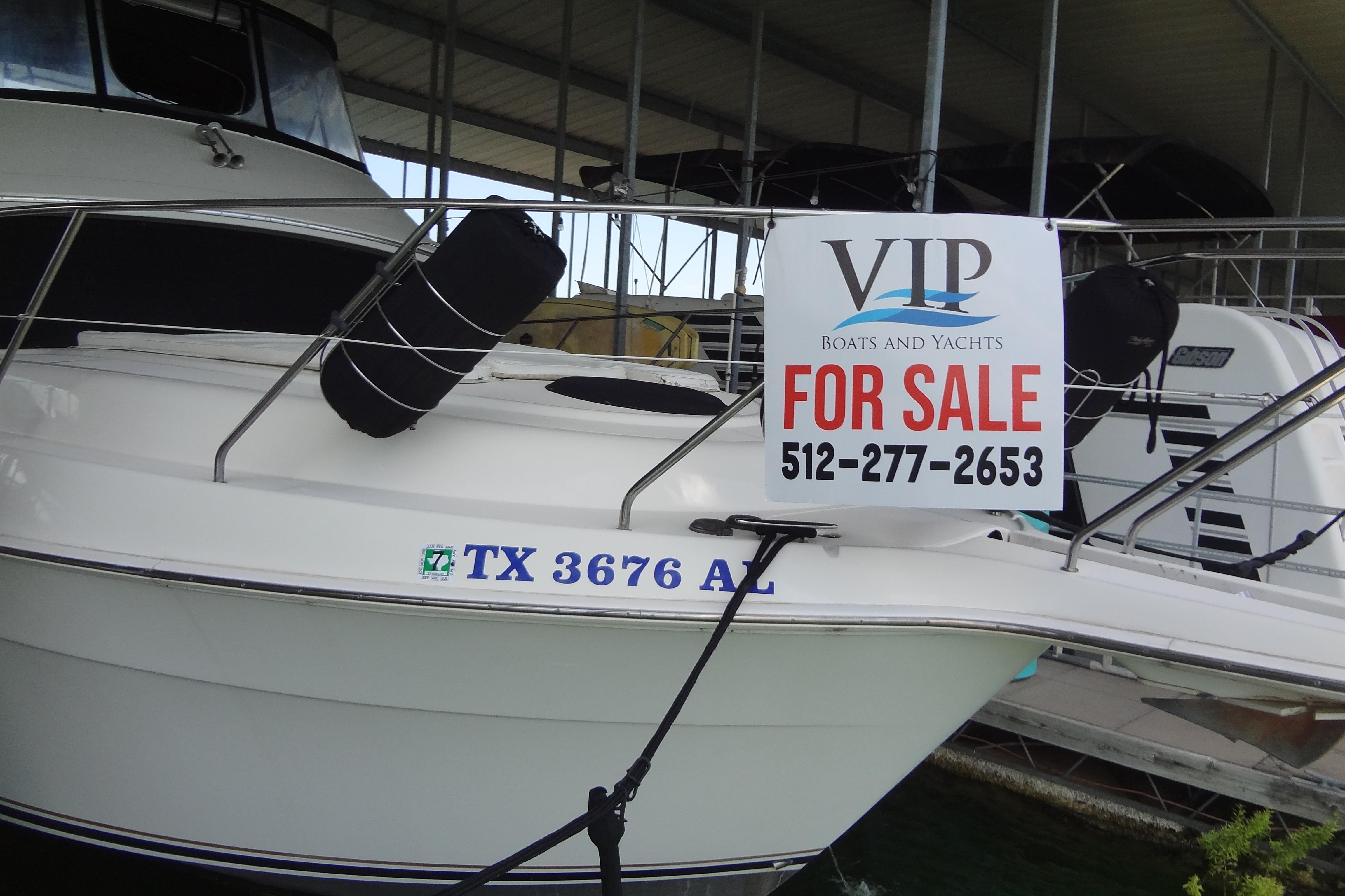 2005 Silverton 34 Convertible boat for sale with contact number displayed.