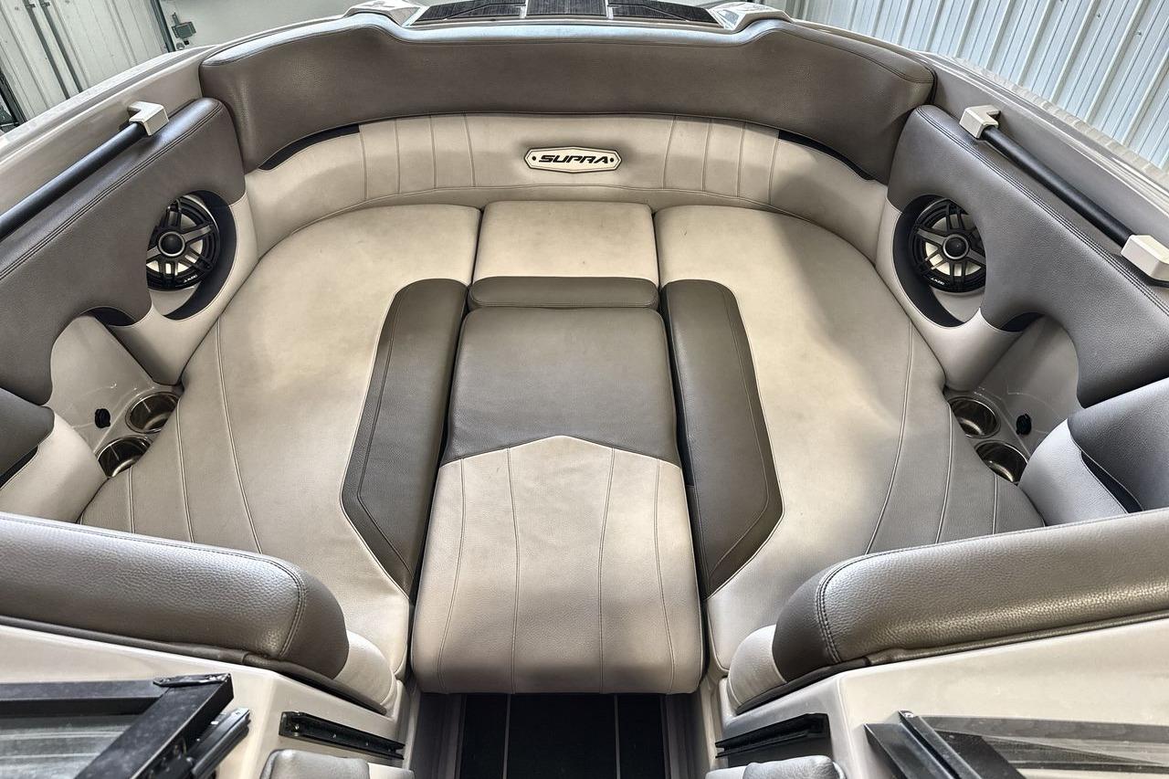 2021 Supra SE 550 boat interior with plush seating and built-in speakers.