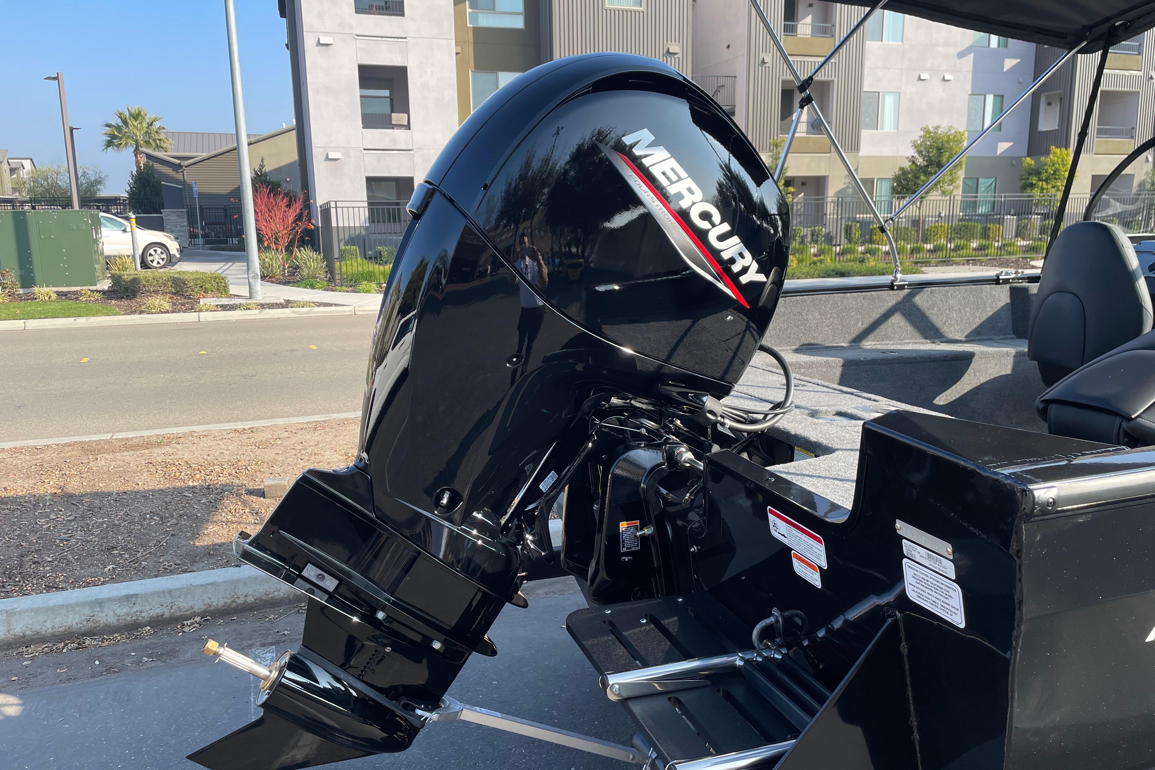 2026 Tracker Pro Guide V-175 WT boat with Mercury outboard motor, parked outdoors.