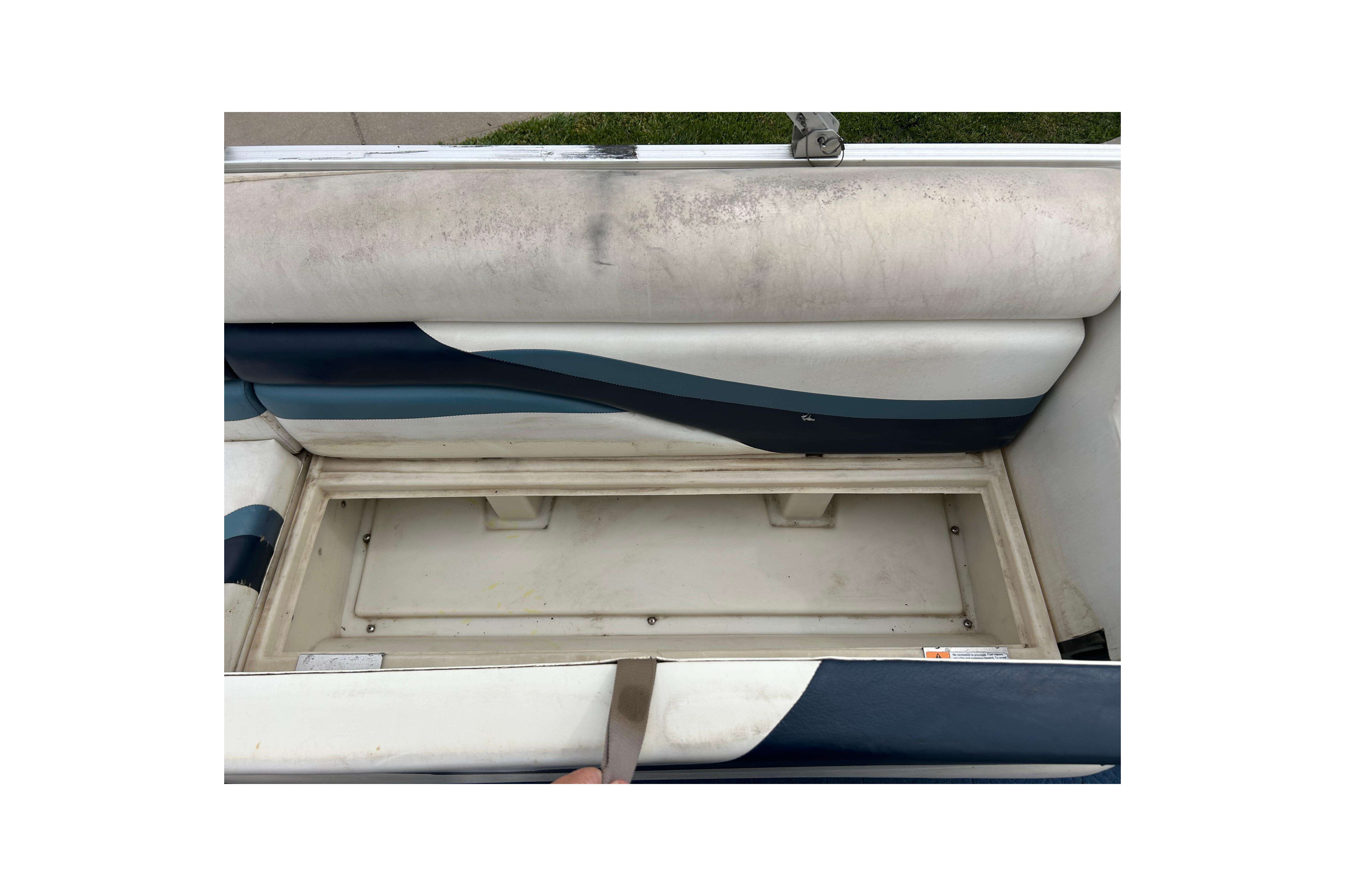 2002 Lowe Trinidad 200 boat seat with storage compartment, featuring blue and white upholstery.