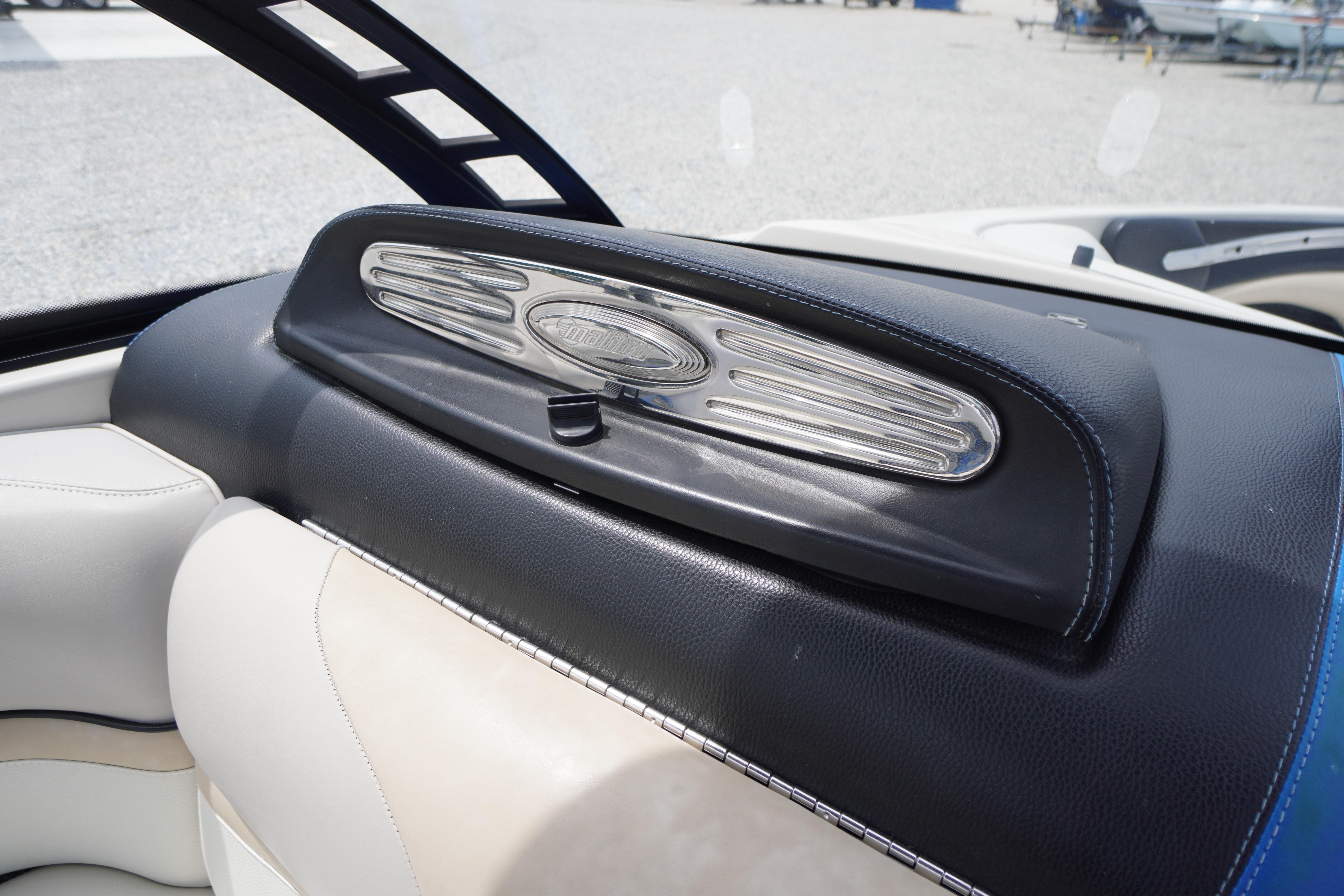 Interior of 2011 Malibu Wakesetter 21 VLX boat, featuring sleek dashboard design.