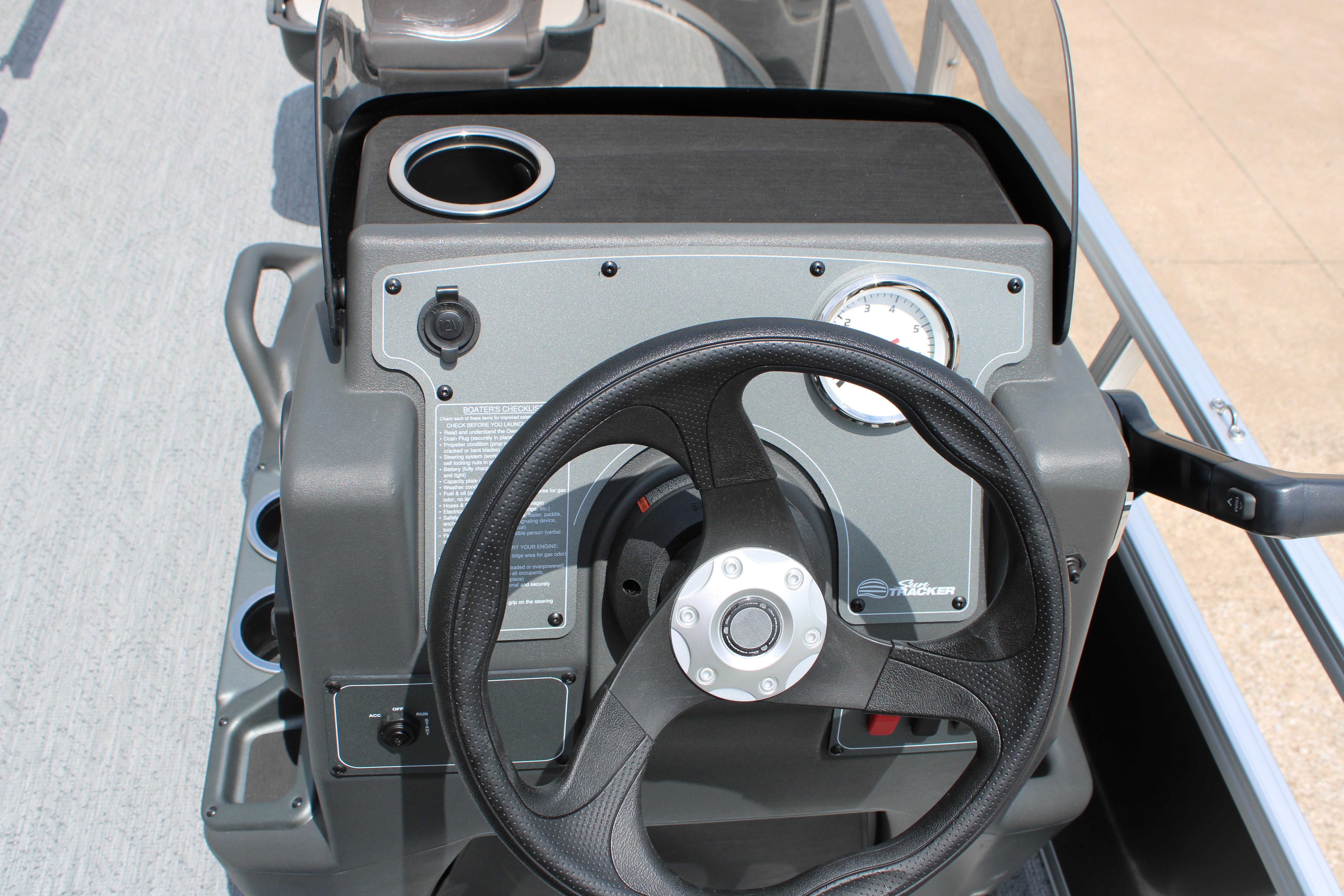 Steering console of 2026 Sun Tracker Bass Buggy 16 XL Select pontoon boat.