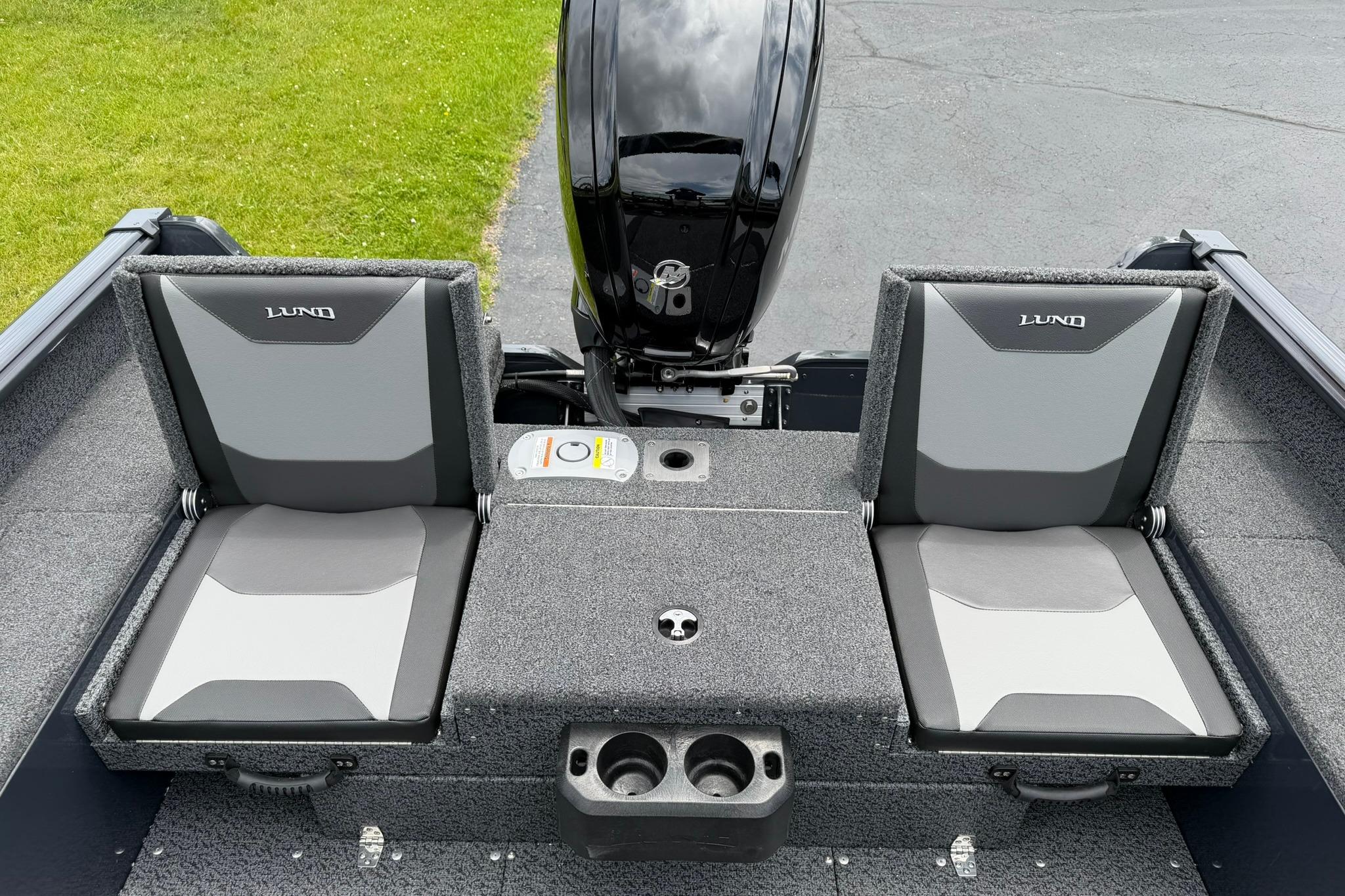 2027 Lund 1675 Adventure Sport boat interior with dual seats and motor.